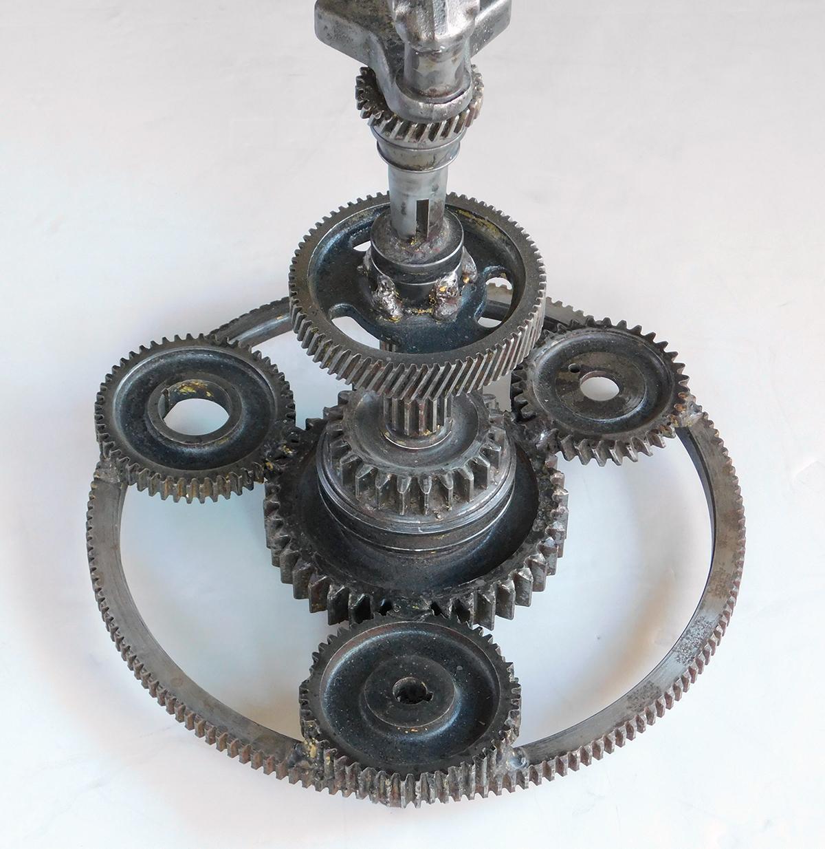 Pair of Industrial Cast Iron Gear Wheel Tables with Circular Glass Tops In Good Condition For Sale In San Francisco, CA