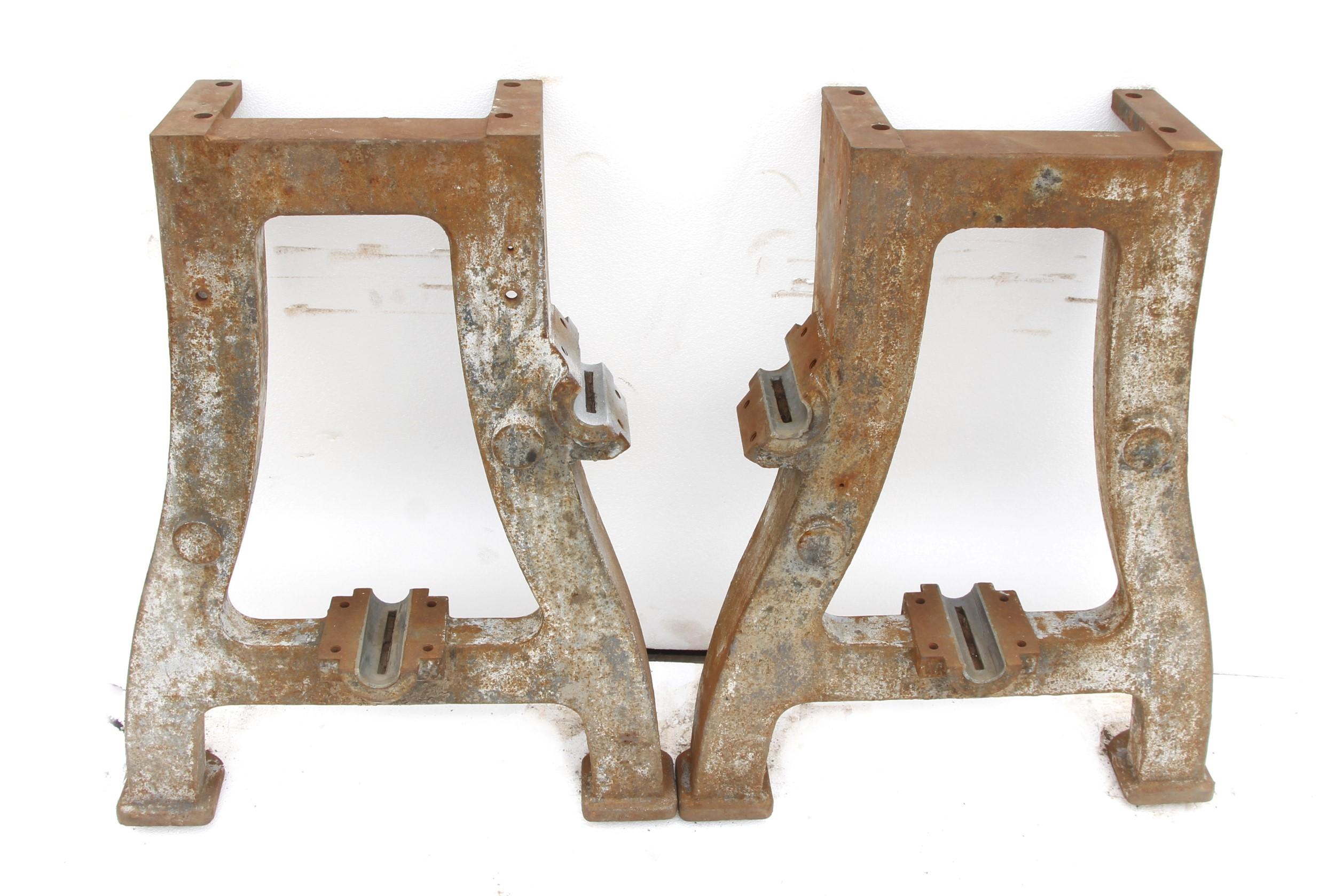 These reclaimed industrial cast iron legs are original to early 1900's heavy machinery.  The surface has a rustic look due to years of weathering but can also be restored to a more polished look if preferred.  Priced as a pair.  This can be seen at