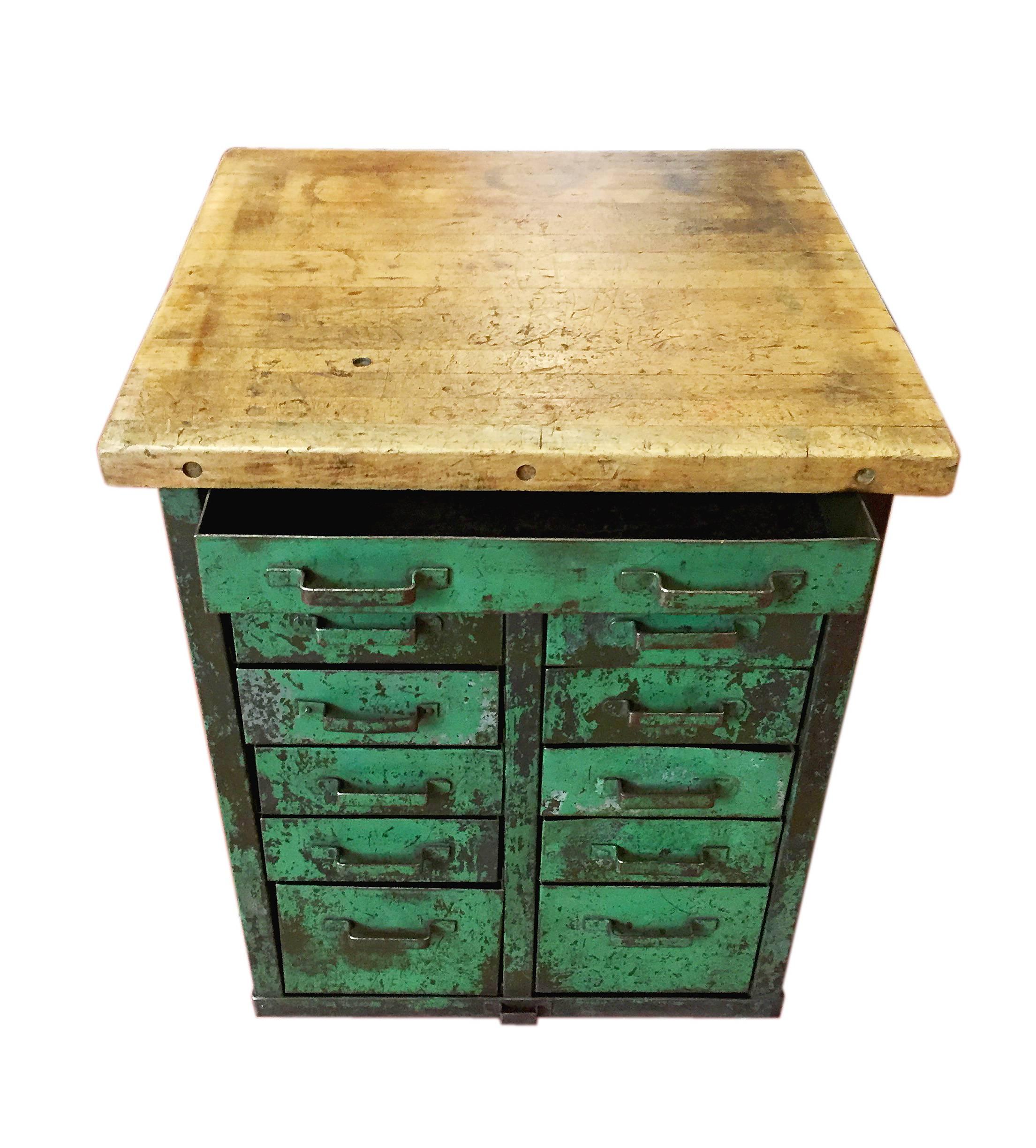 A pair of French Industrial square chests of drawers, made out of the painted iron sheet of green color with laminated wood shelf plank and four wheels. Wheels added recently. Two available, 2.300,00 Euro each one. France, 1920.