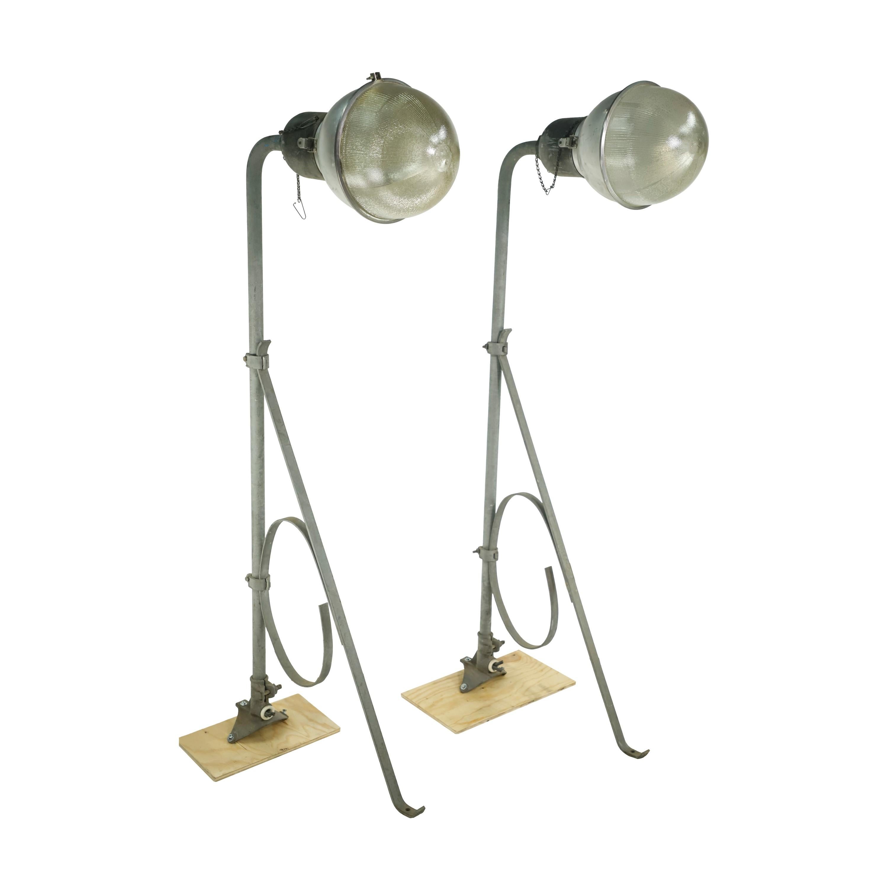 Large outdoor industrial style street lamps with prismatic glass shades. Cleaned and restored. upon purchase. Priced as a pair. Please note, this item is located in our Scranton, PA location.
