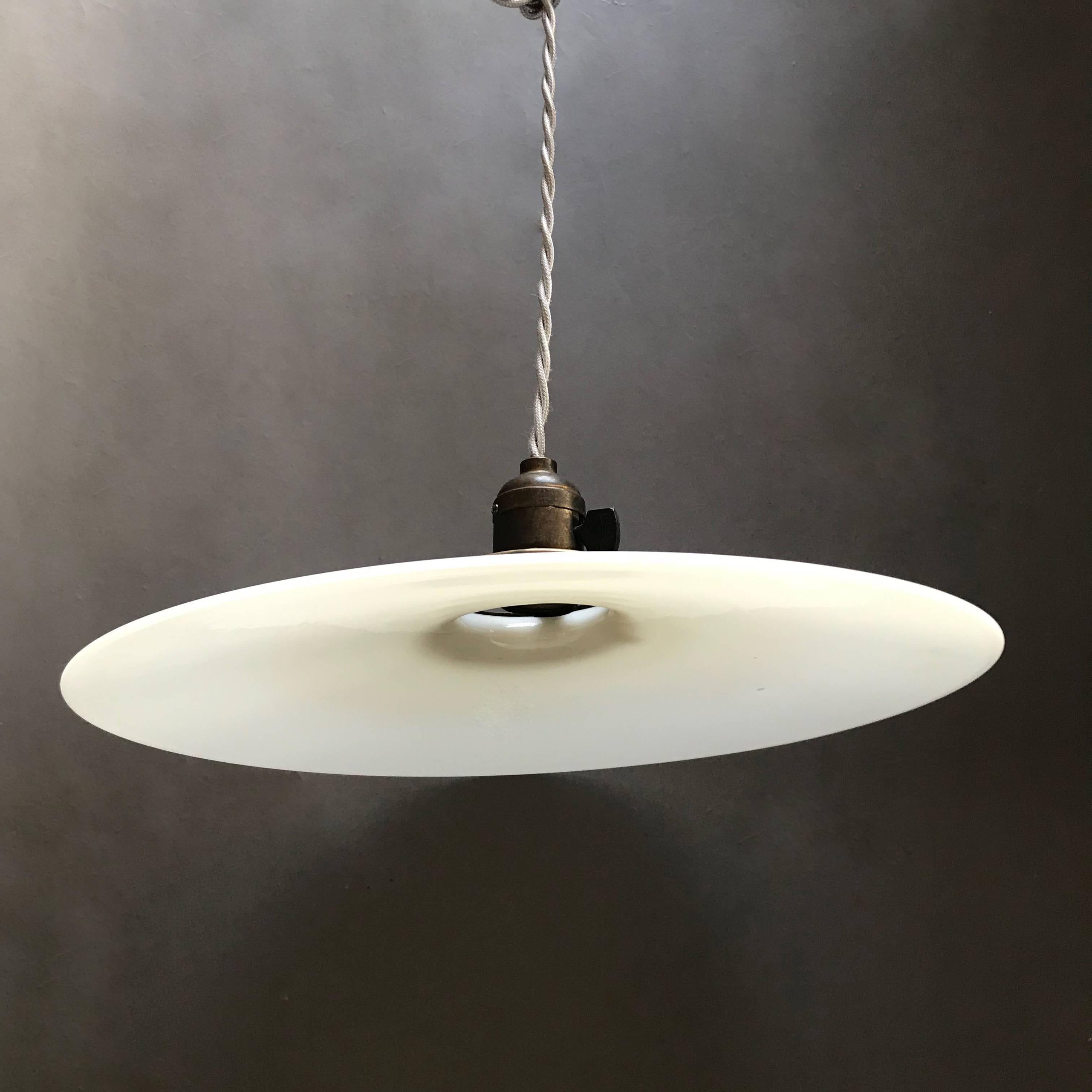 Pair of Industrial Milk Glass Disc Pendant Lights In Excellent Condition In Brooklyn, NY