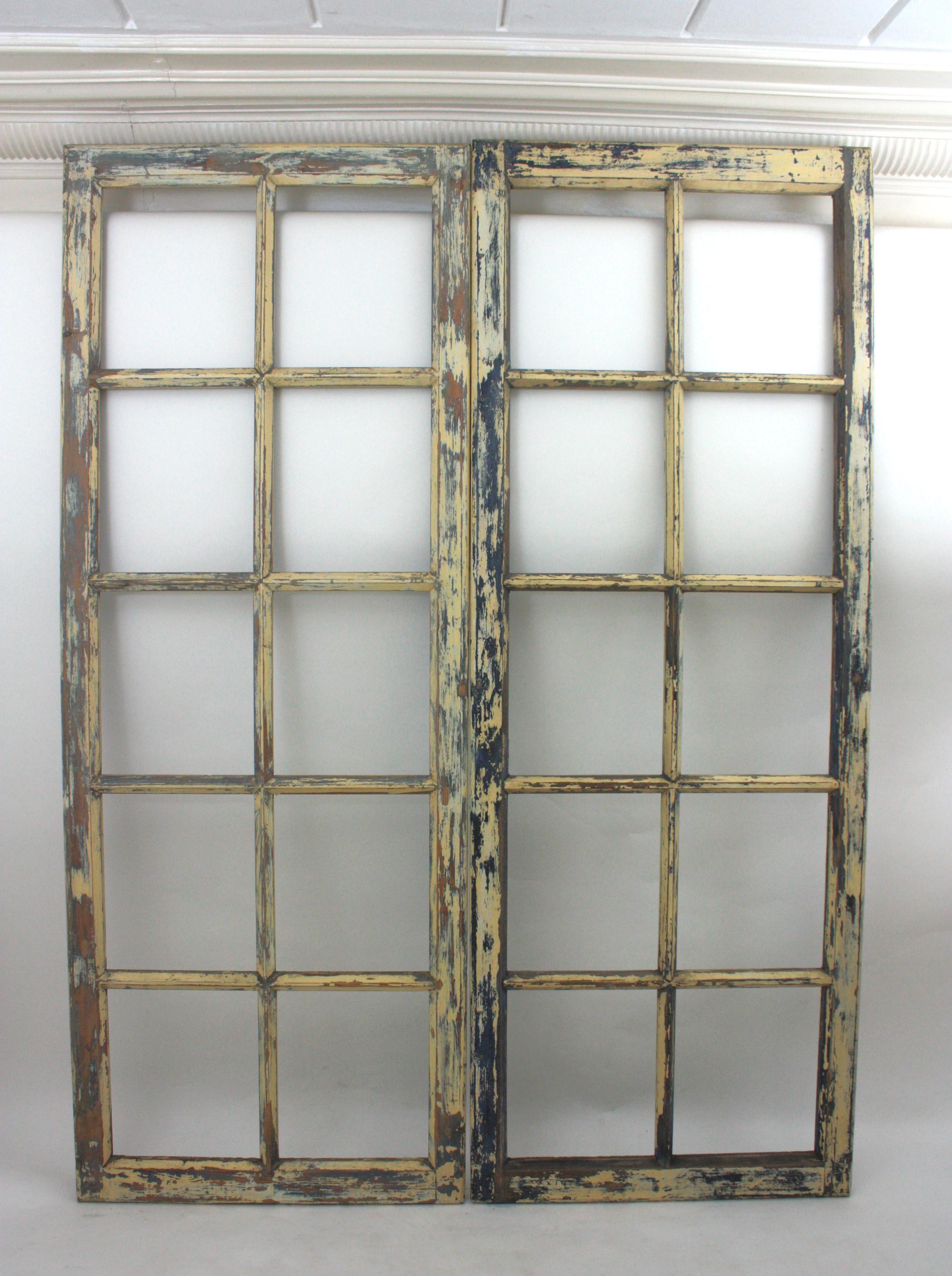 Antique Factory Paneled Wood Windows to be used as Windows or Doors, Spain, 1930s-1940s.
Pair of blue and ecru painted industrial wooden windows with panels to be used as doors, windows  or wall decoration.
These doors have an interesting original