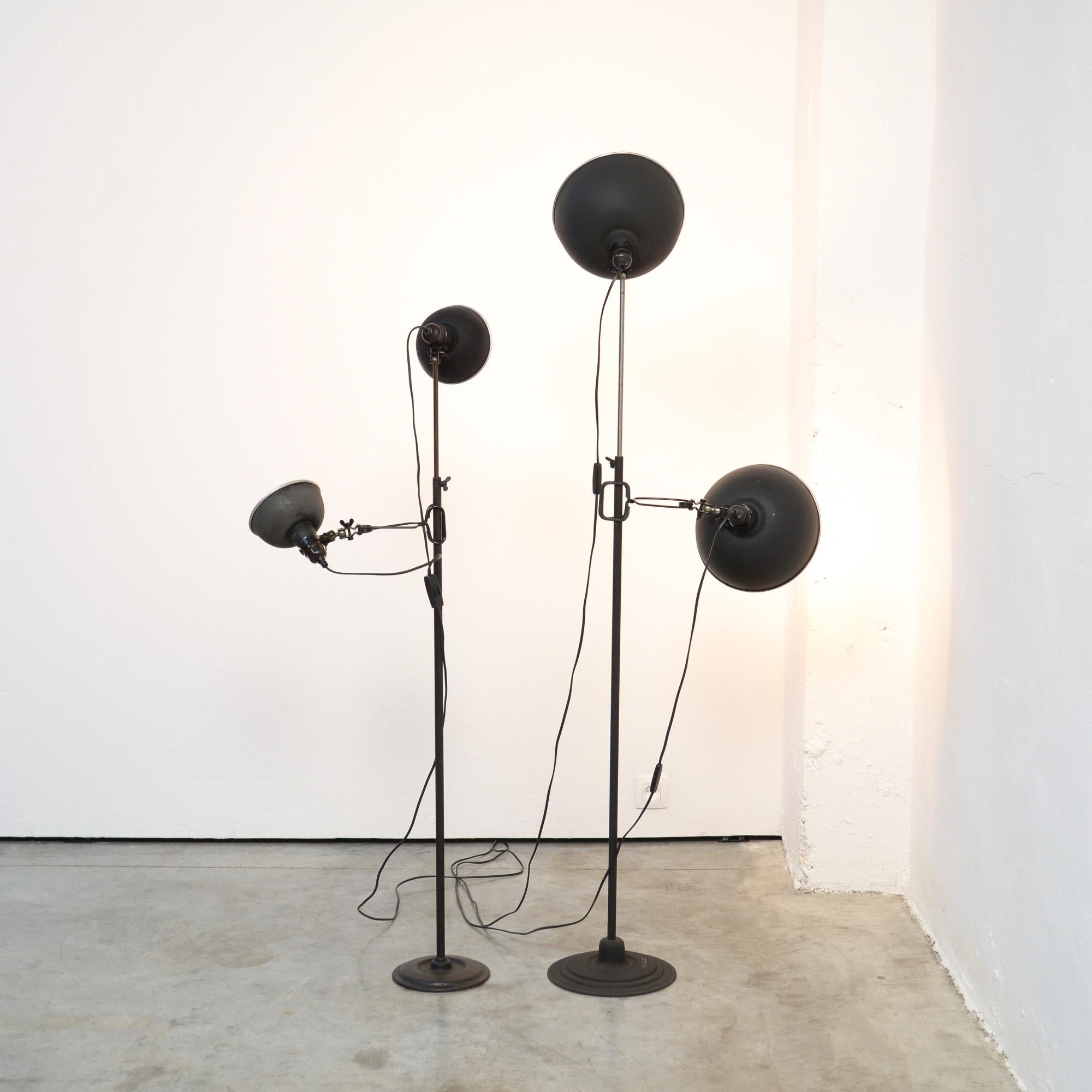 These industrial metal studio lamps were manufactured by KAP in the 1950s. The stems are adjustable in height and the lampshades can be turned.
There are 2 separate clip lamps that can be put on the black stems. The shade have a diameter of 26 cm