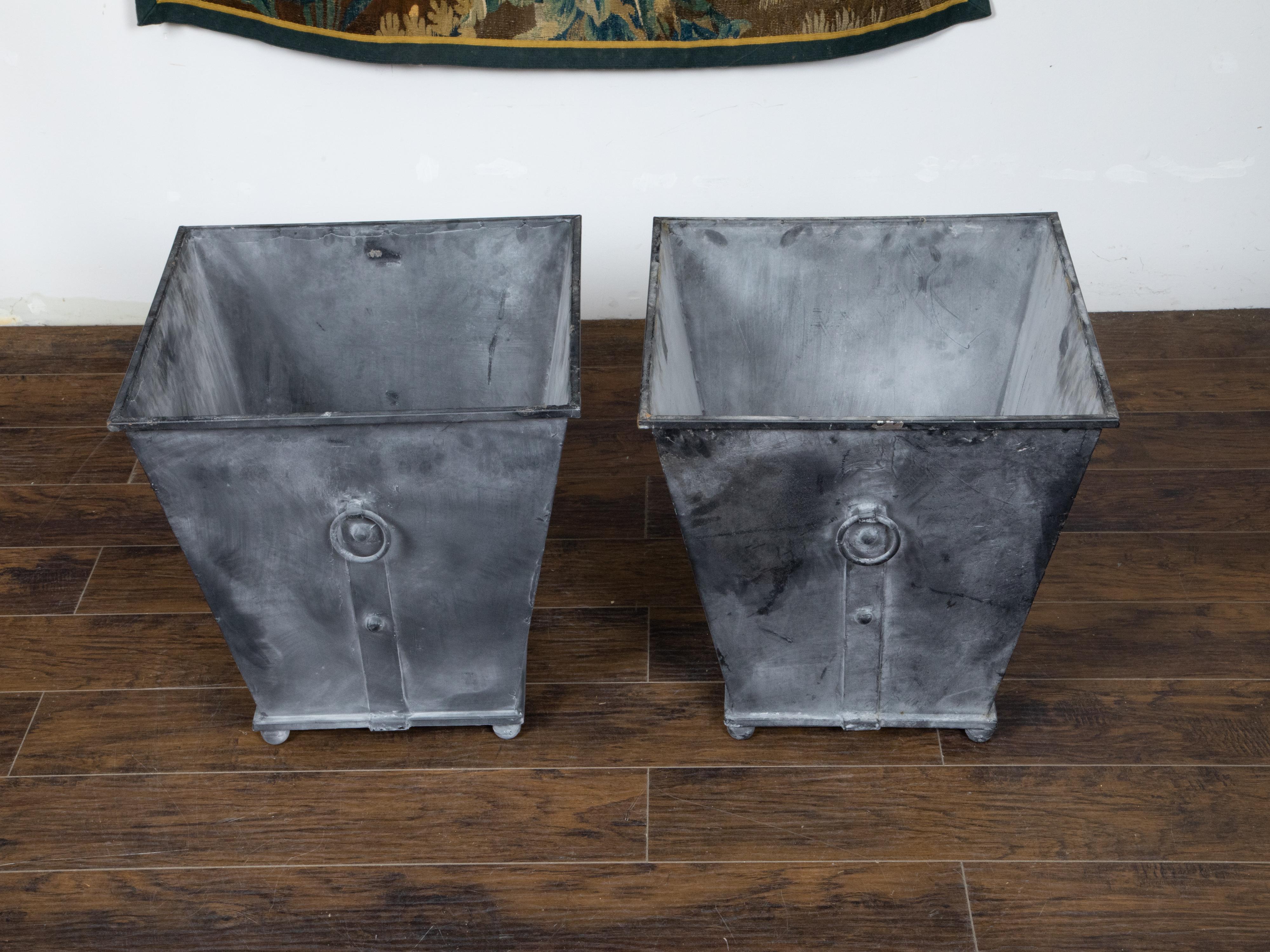 Patinated Pair of Industrial Style Grey Metal Planters with Tapered Lines and Ring Pulls For Sale