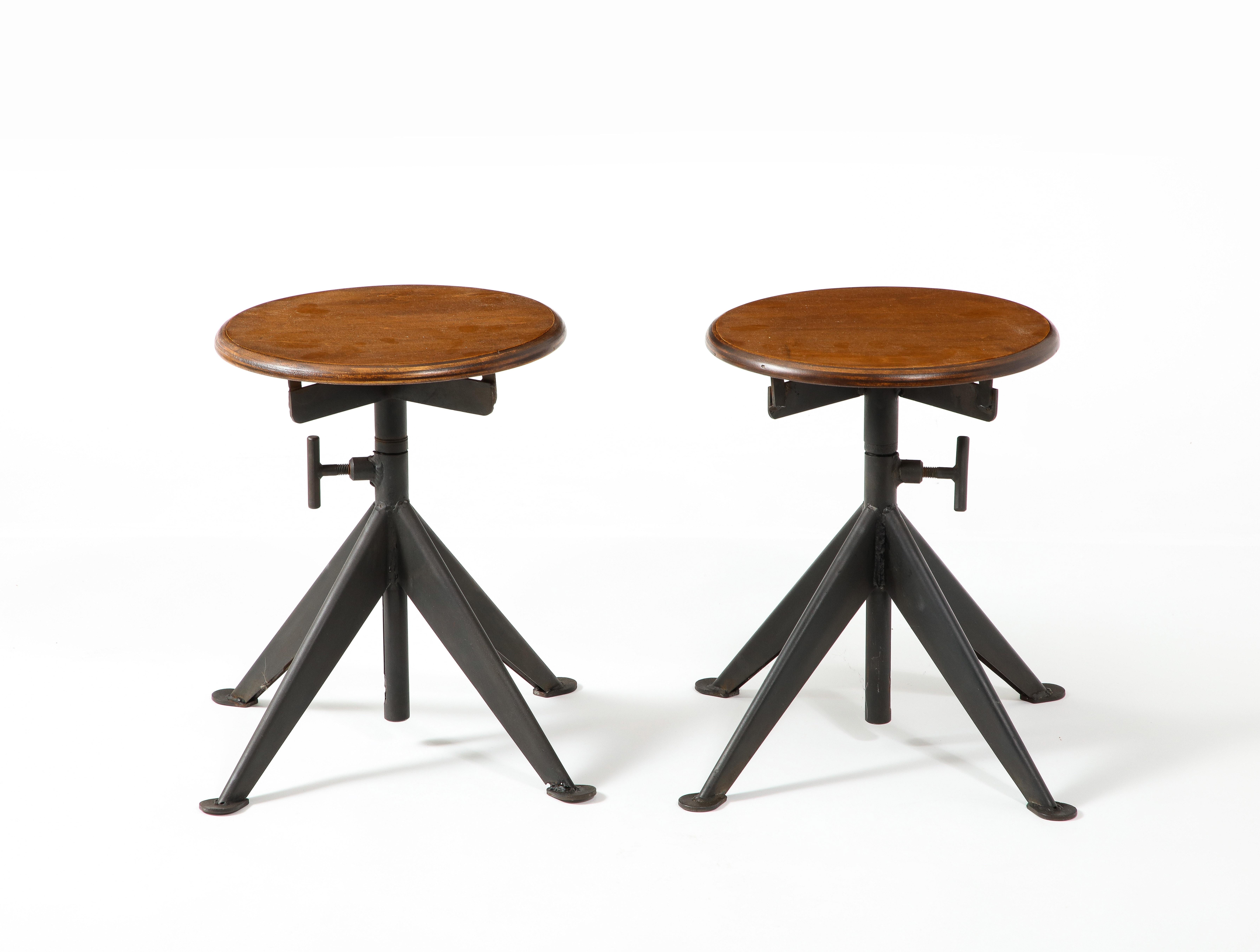 Pair of fully adjustable Iron and Plywood stools by Odeberg.
