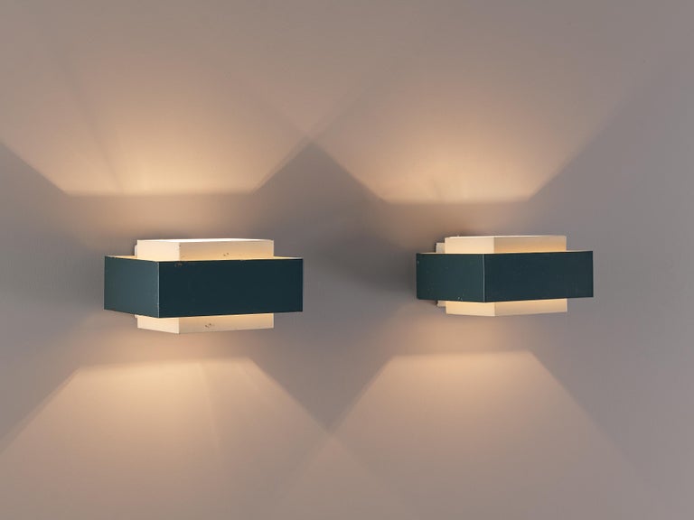 Wall lights, metal, The Netherlands, 1950s

These subtle pair of wall lights show strong resemblance to the designs of Louis Kalff (1897-1976). The light is equivalently divided creating these geometrical shapes on the wall due to the square