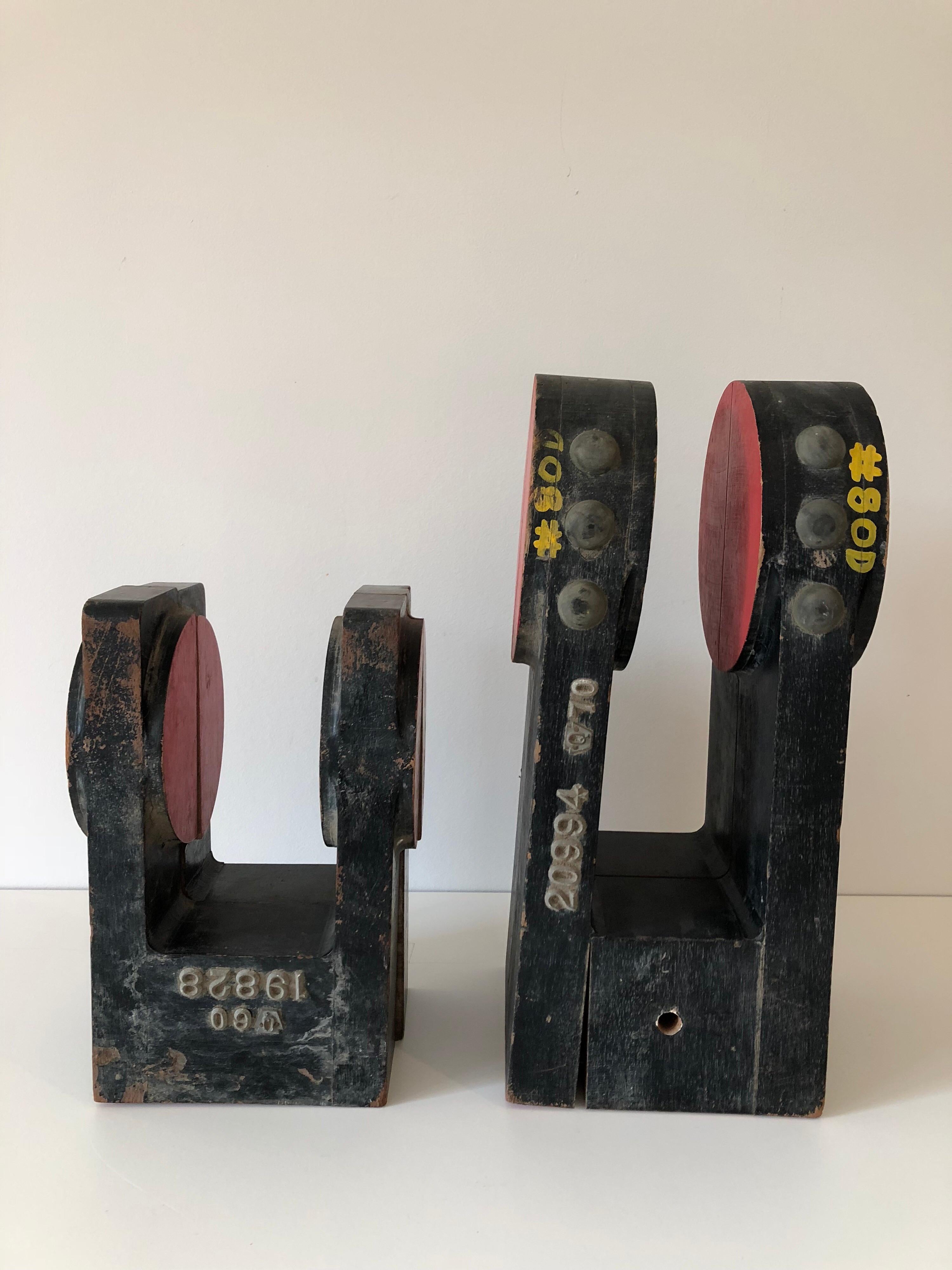 Pair of industrial wood factory mold sculptures. Excellent tabletop decoration or book ends. Each separates in two.
Measures: Large measures 15.25
