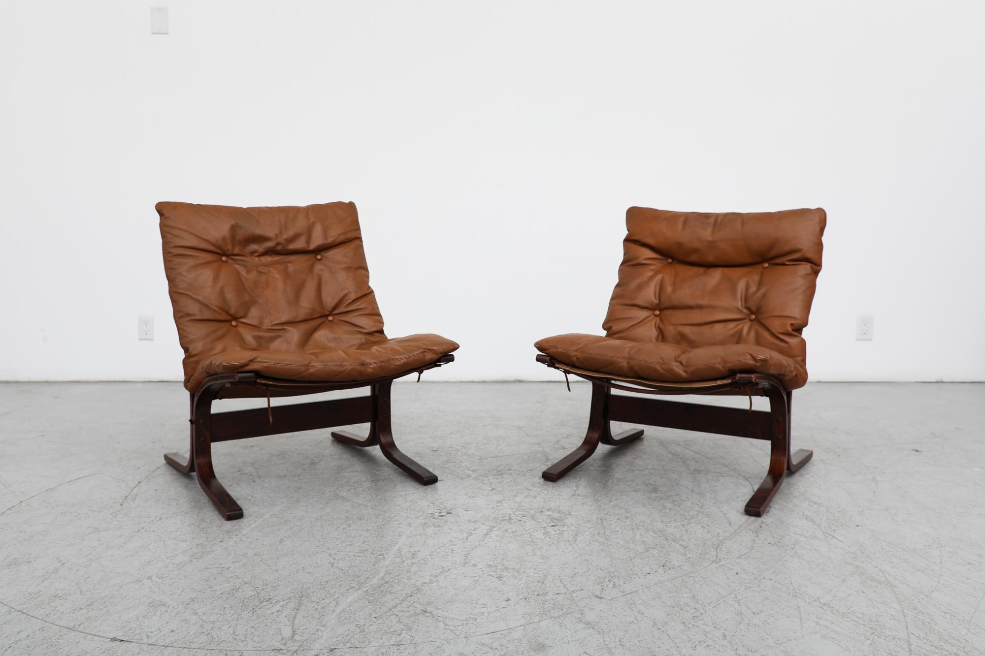 Mid-Century Westnofa 'Siesta' lounge chairs in natural brown leather with bentwood frames and canvas supports. Ingmar Relling's most famous creation, the Siesta Chair, was created in 1965 and won first place at the Industry Council for Furniture and
