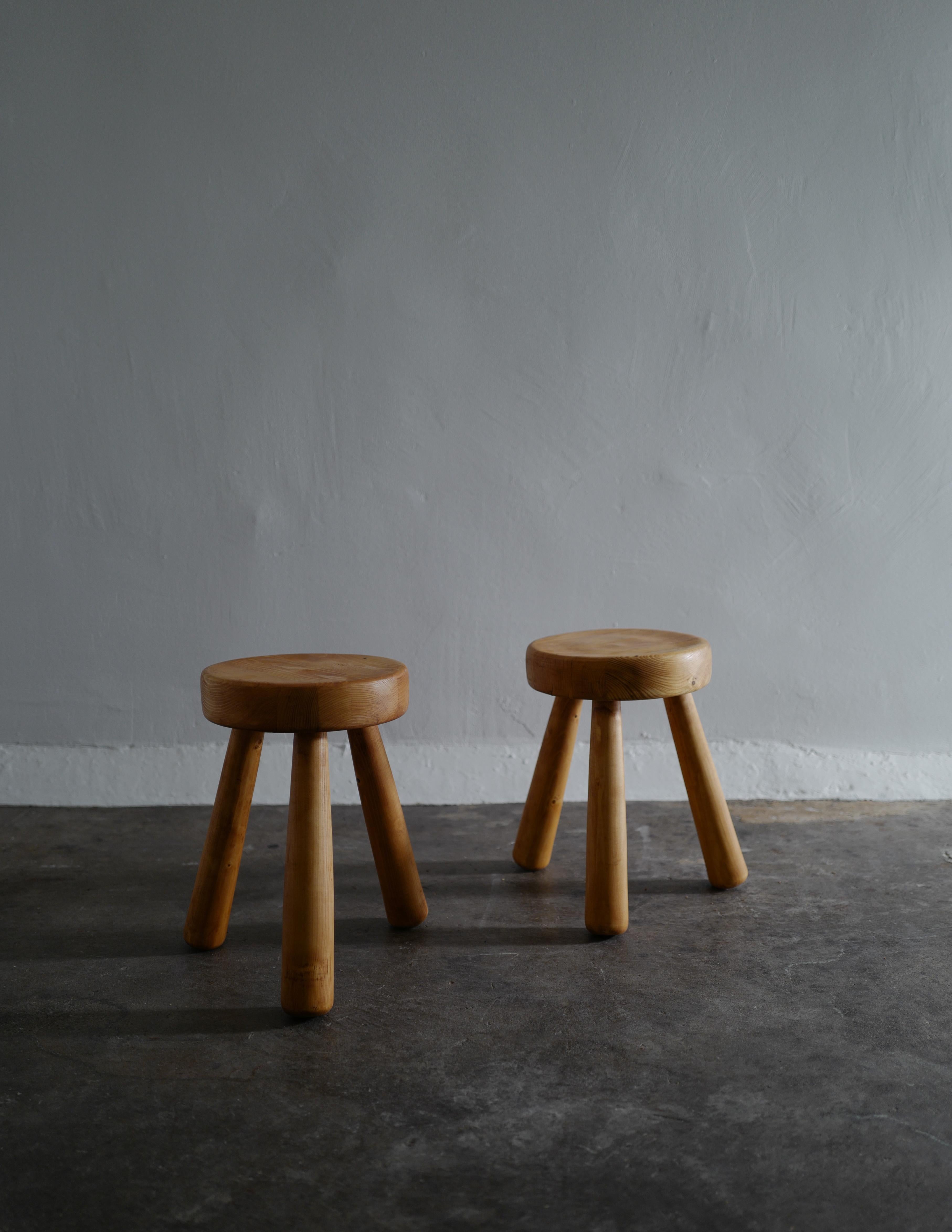 Rare pair of stools in pine by Ingvar Hildingsson made in the 1970s. Both are signed with his initials I.H.