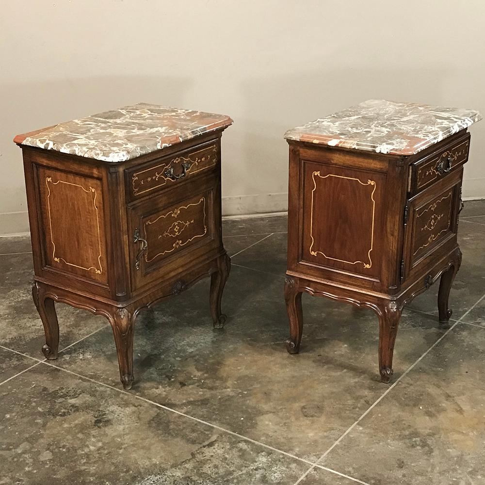 Pair of inlaid walnut Italian Piedmontese Rococo marble top nightstands make ideal bedside companions and feature beautiful yet neutral original Italian Breccia marble tops for a touch of elegance, 

circa early 1900s.

Each measures: 27 H x 21