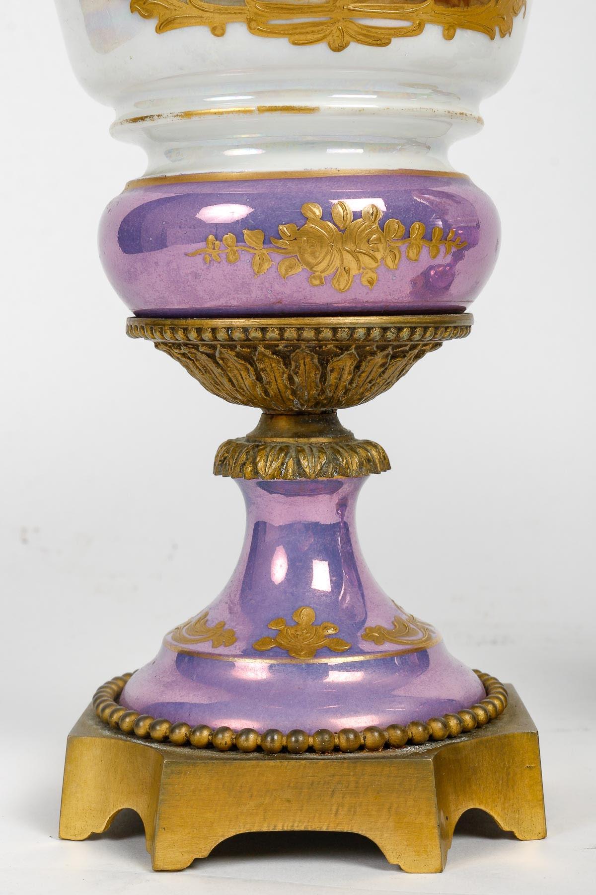 French Pair of Iridescent Sèvres Porcelain and Gilt Bronze Covered Vases, 19th Century.