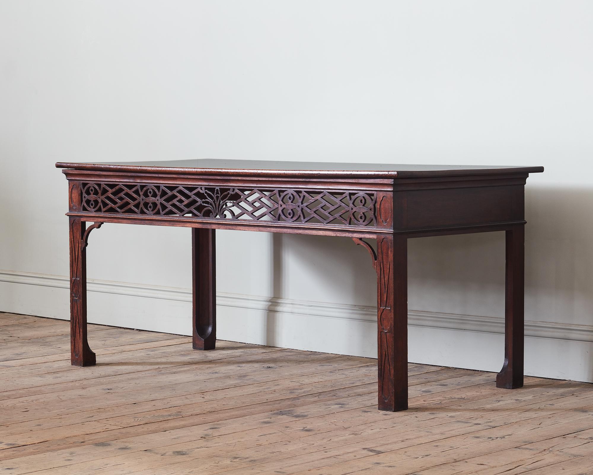 A Exceptional Pair of Irish Late 18th Century Mahogany Serving Tables

With a nod to 18th Century Chinese Chippendale form, each with a rectangular moulded top above an open fret cut frieze, raised on four square chamfered blind fret