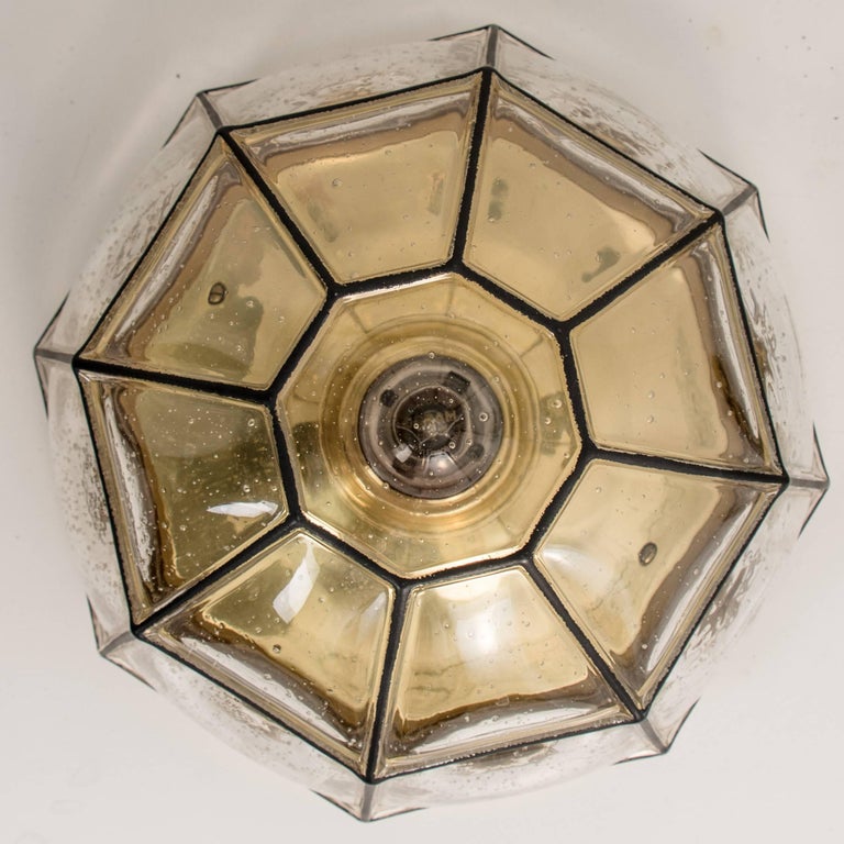 This beautiful and unique octagonal pair of glass light flush mounts or wall lights were manufactured by Glashütte Limburg in Germany during the 1960s (Late 1960s or early 1970s). Beautiful craftsmanship. Each lamp, made from elaborate clear glass
