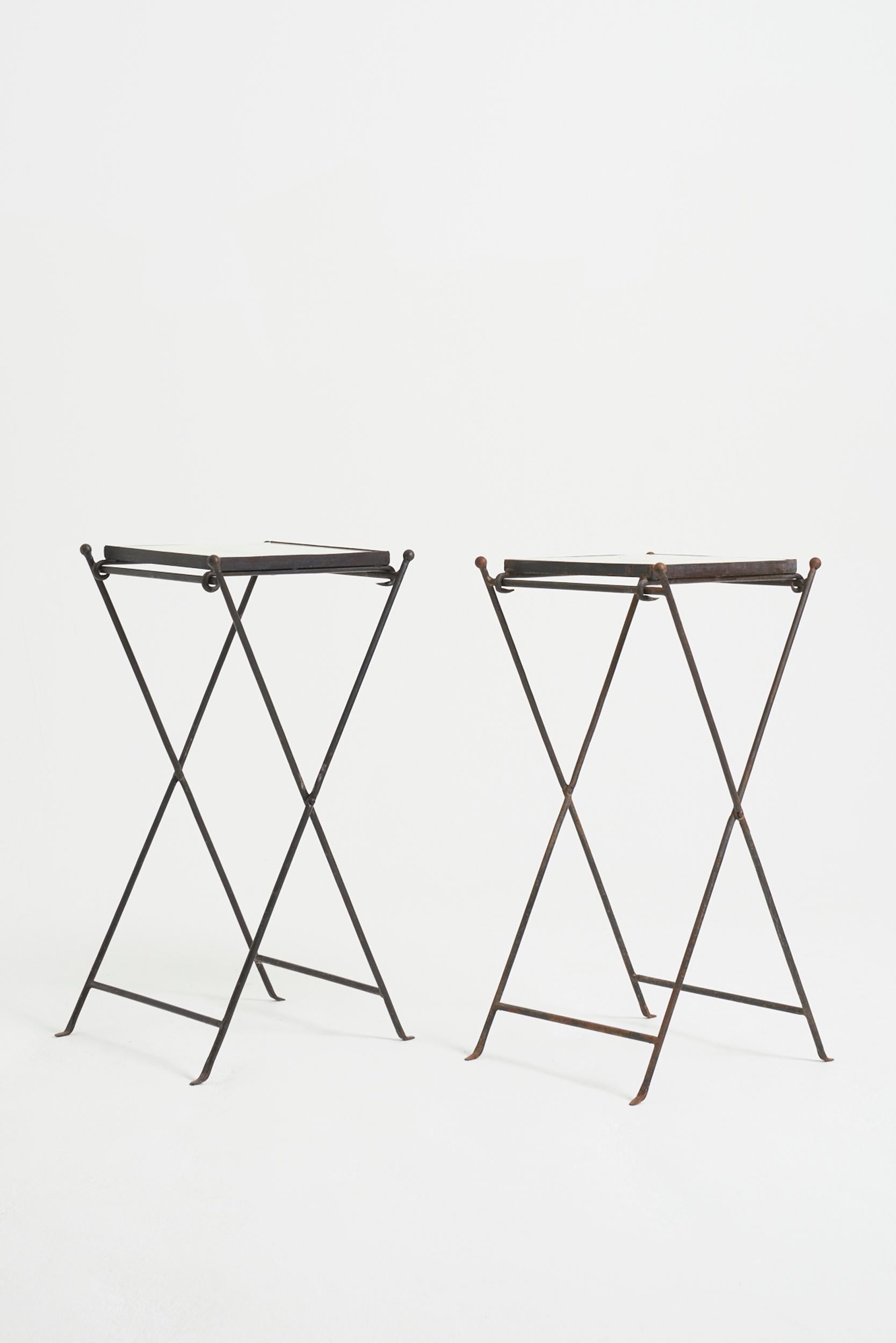 A pair of tall marble top black iron folding tables.
France, 1950s
79 cm high by 45.5 cm wide by 35.5 cm depth
