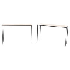 Pair of iron and parchment console tables having tapered legs