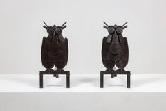 Pair of iron andirons, representing an owl. 1950s.