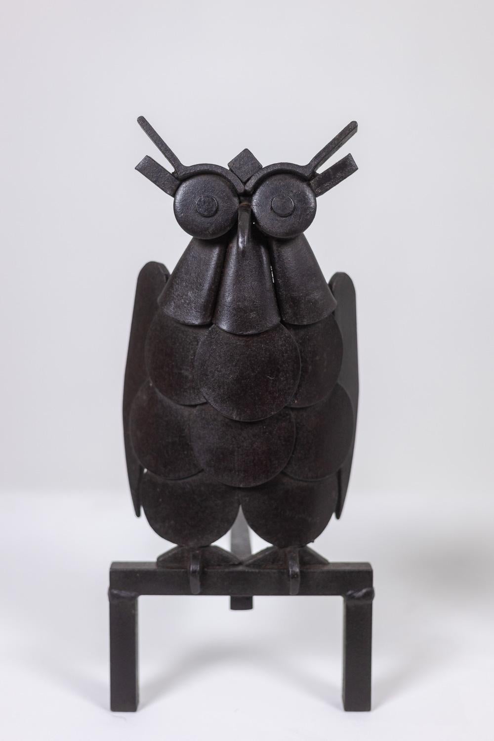 20th Century Pair of iron andirons, representing an owl. 1950s.