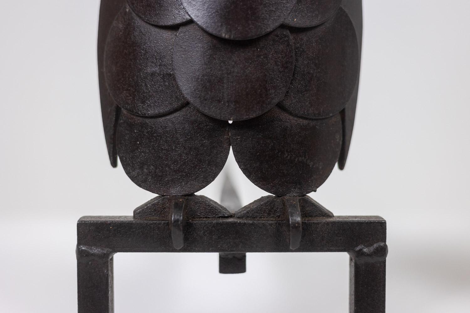Pair of iron andirons, representing an owl. 1950s. 1