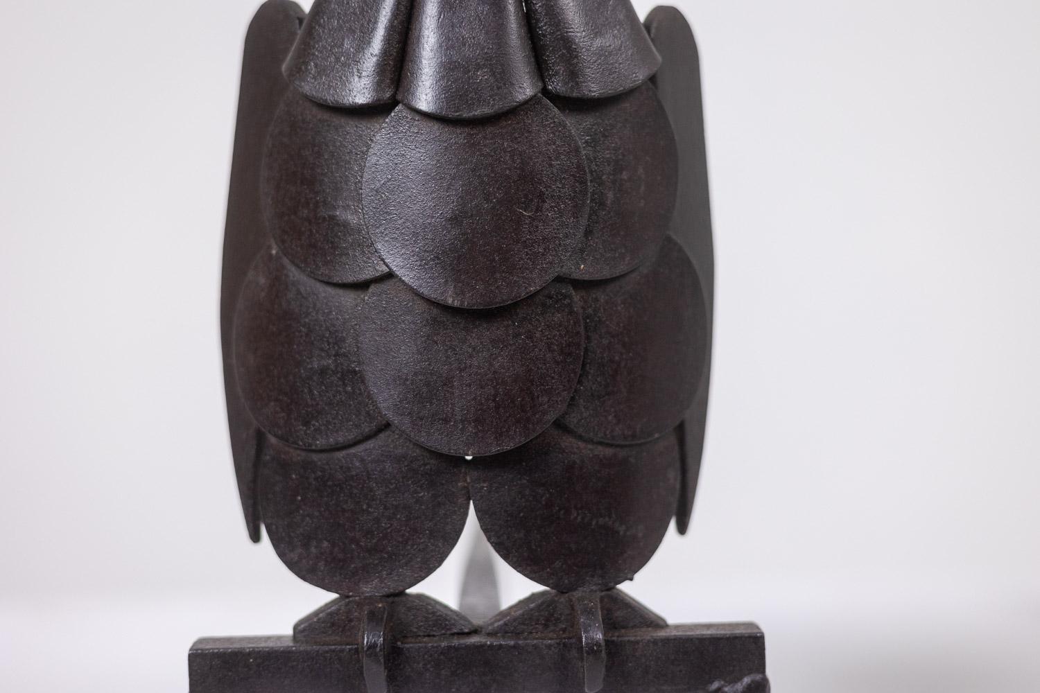 Pair of iron andirons, representing an owl. 1950s. 2