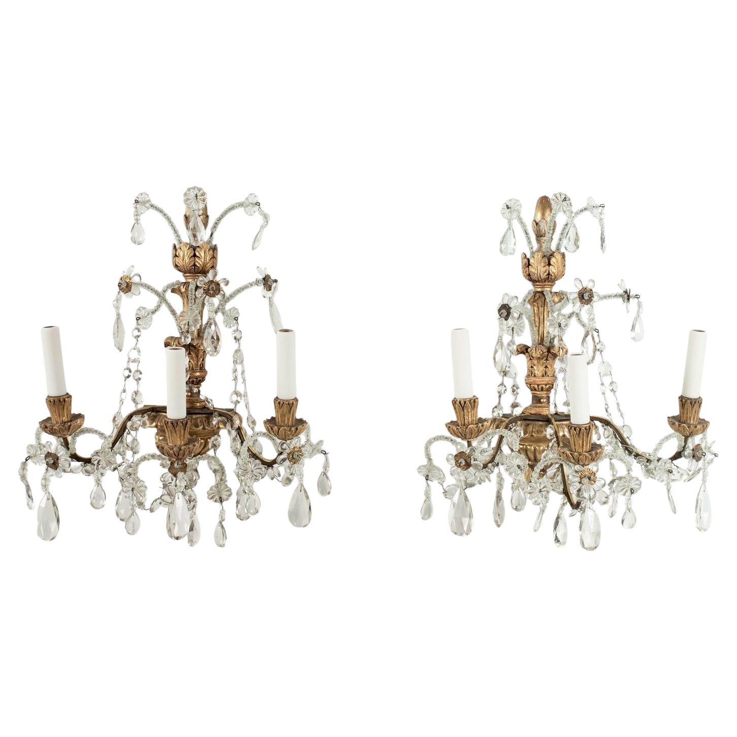 Pair of Iron, Crystal and Carved Giltwood Sconces