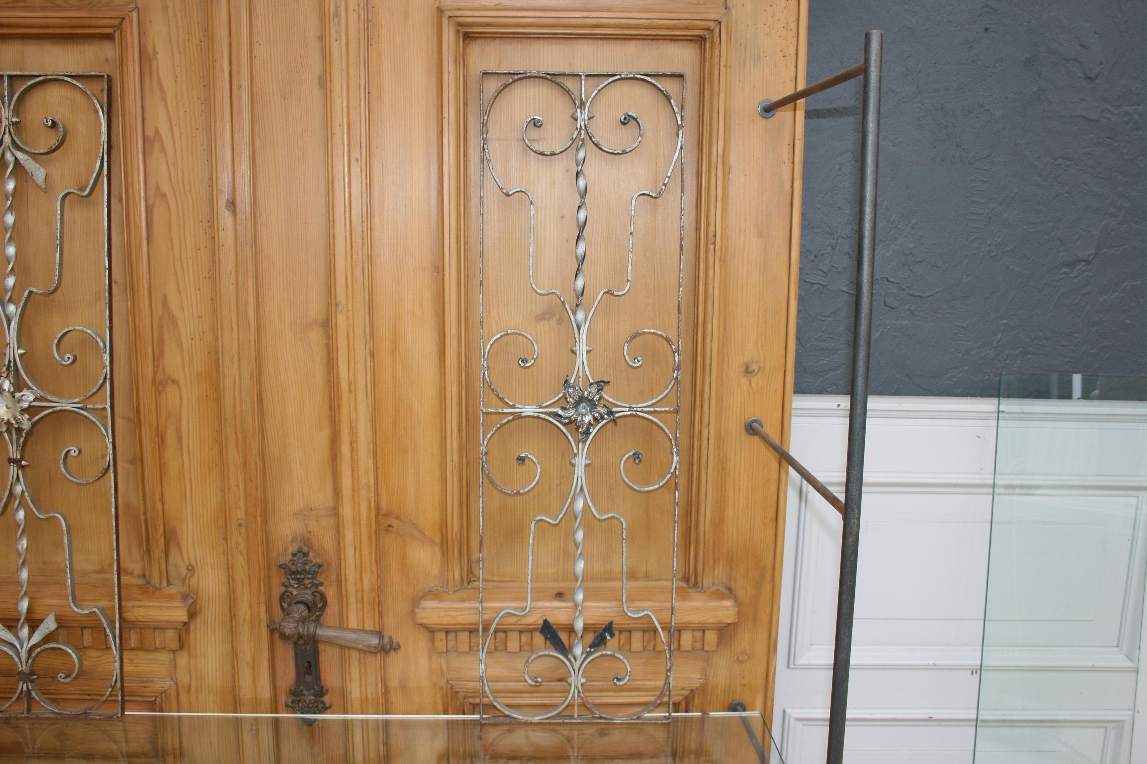 A pair of iron door grills or grates. Also very decorative as an object hanging on the wall.

Dimensions:
87 cm high / 34.25 inch high,
26.5 cm wide / 10.43 inch wide,
1.5 cm deep / 0.59 inch deep.