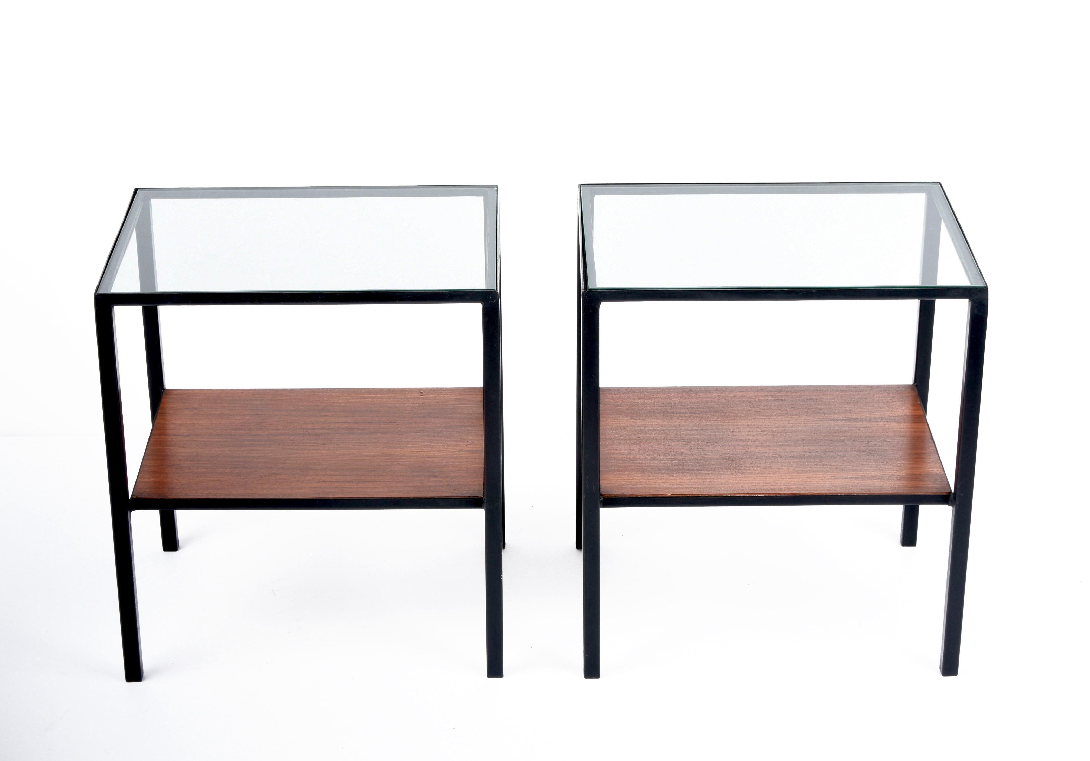 Amazing pair of midcentury two-level coffee tables, one glass top shelf and one wooden shelf. These fantastic side tables were designed in Italy during the 1960s.

Amazing pieces with straight lines and a clean and pure structure in black