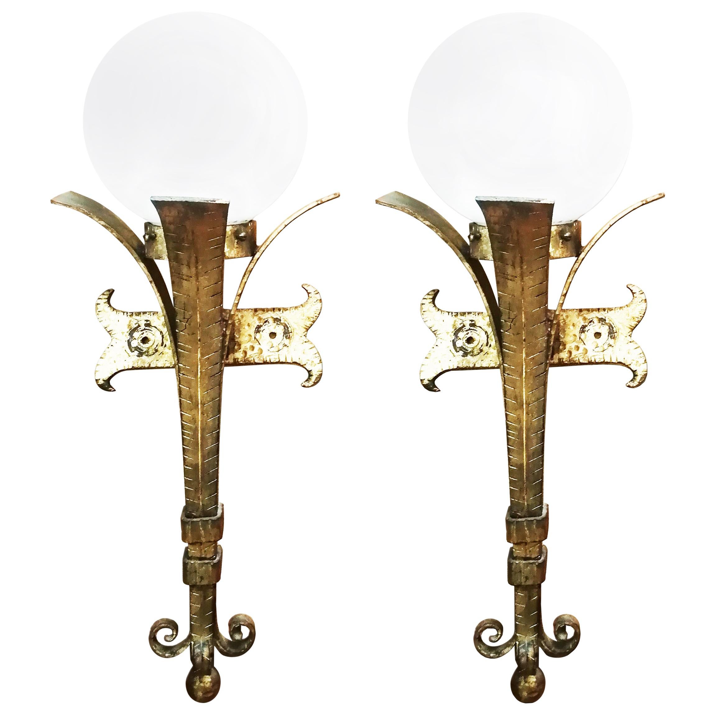  Pair of  Torch Form  Wall Sconces Wrought Iron & Gold Leaf With Glove Opaline Glass, 

Pair of iron gloden wall lamps or sconces torch form with glove Opaline glass

Midcentury torch lamp iron wall sconces with opaline glass

Sconces iron golden