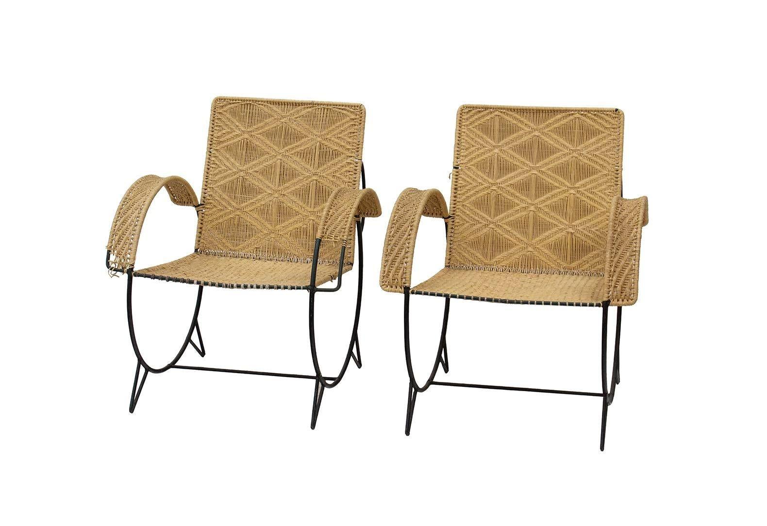 USA, 1950s
Pair of iron hoop chairs with woven seats and backs. Unknown designer, in the style of Van Keppel & Green or Luther Conover. Sculptural form with two circles forming the hoop frame.
Matching round petite coffee table also available in our