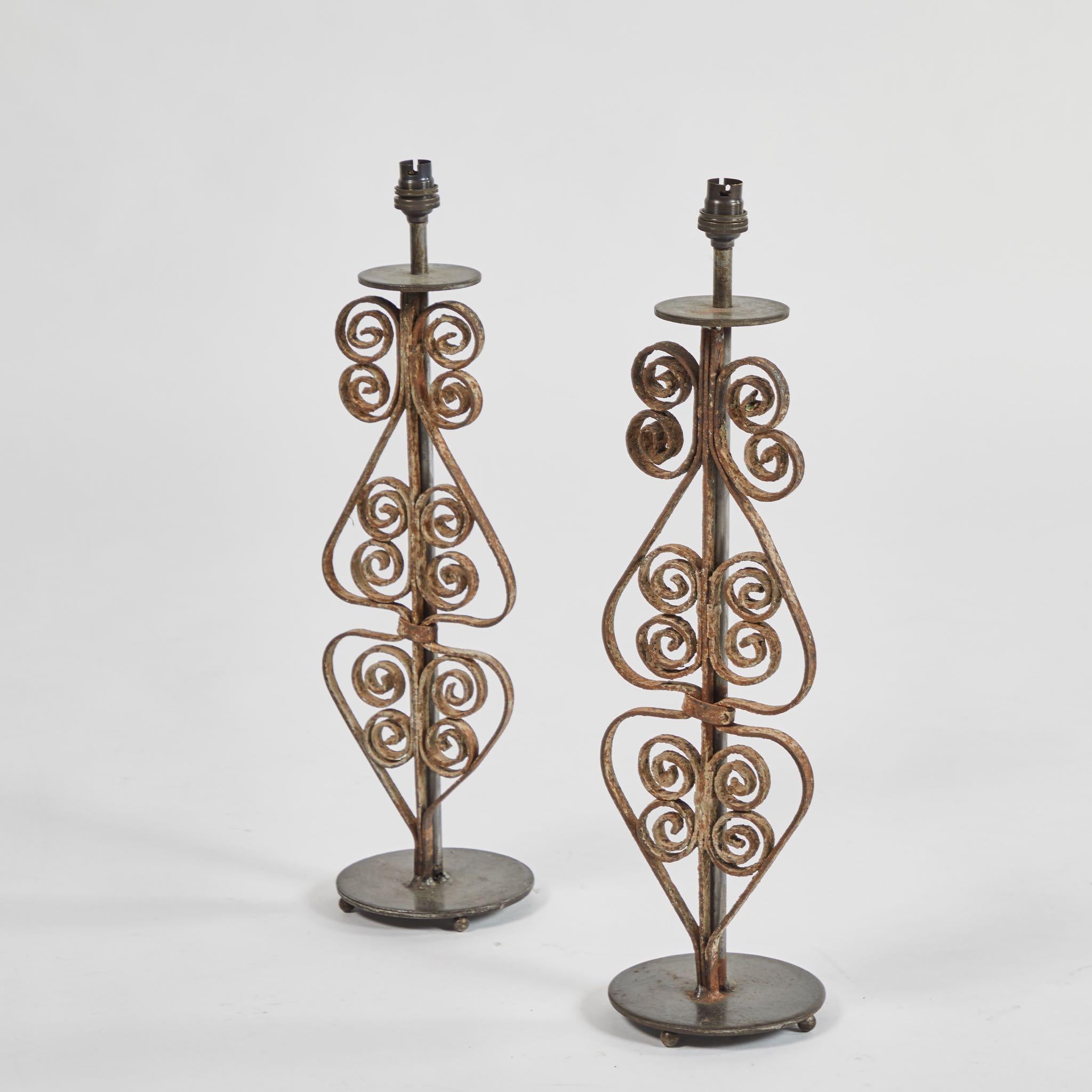 Pair of iron lamps with custom shades, originating in England, circa 1880.
