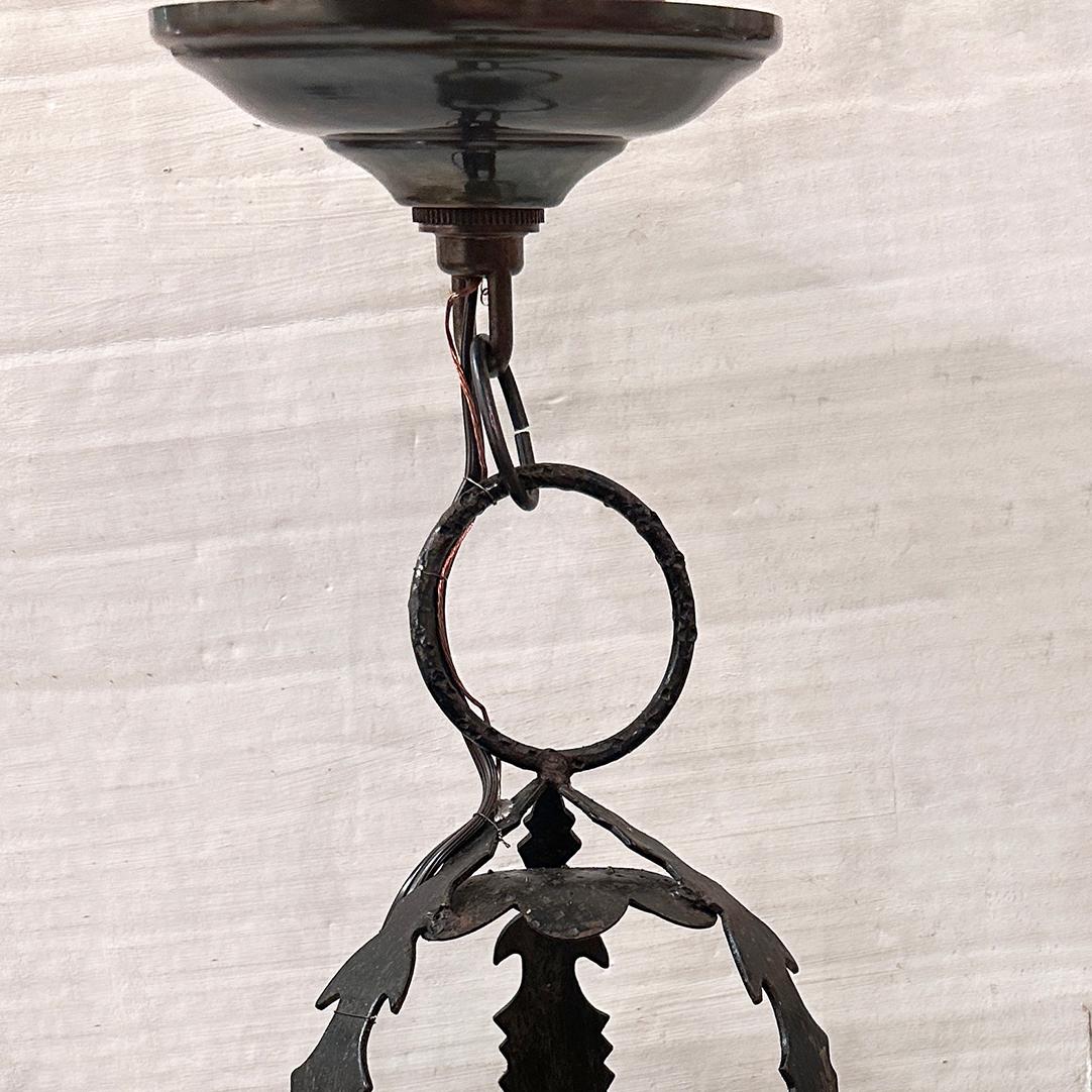 Pair of 1940's Italian hammered iron lanterns with amber glass insets. Sold individually.

Measurements:
Drop: 16
