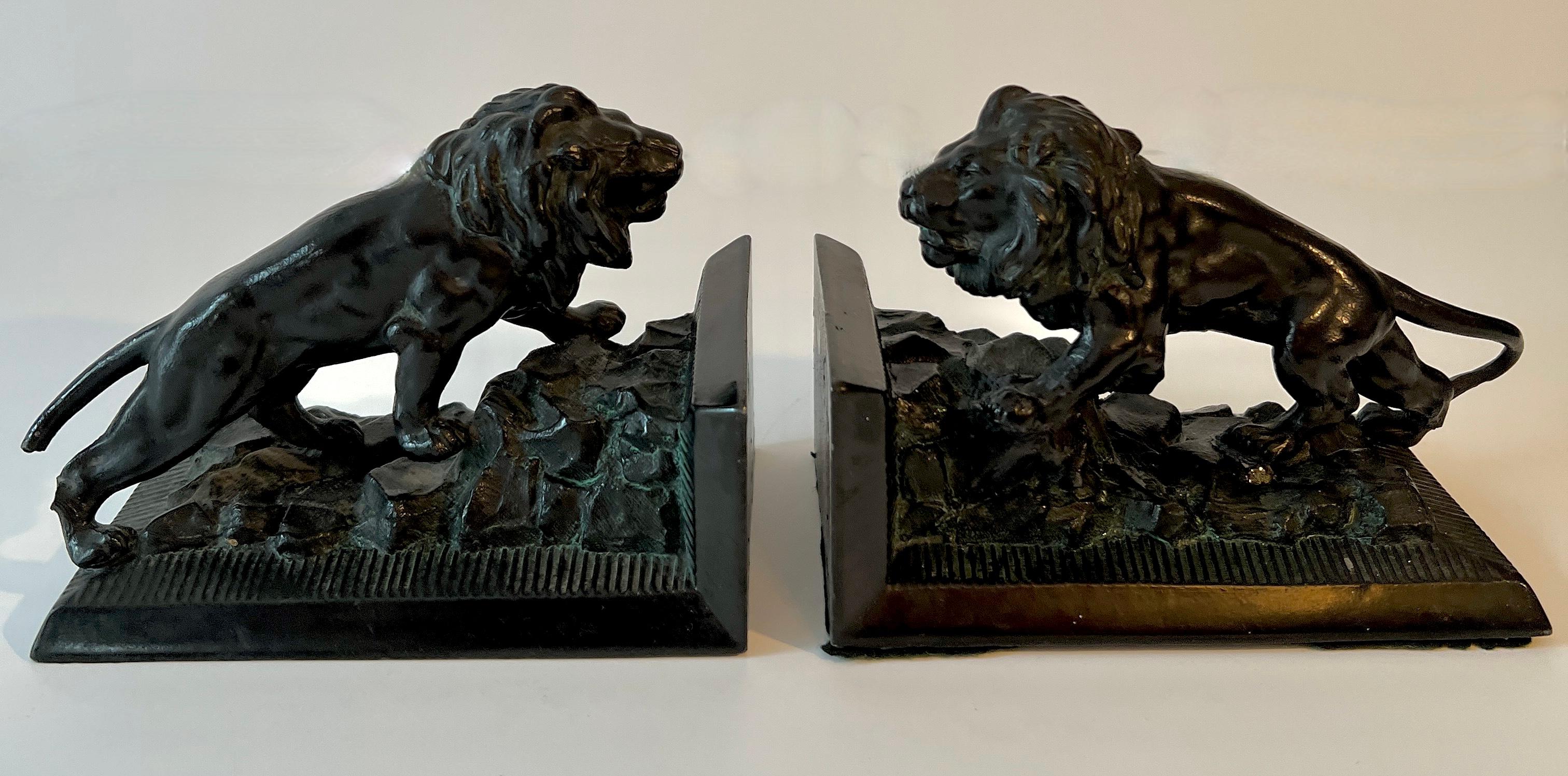 Patinated Pair of Iron Lion Bookends For Sale