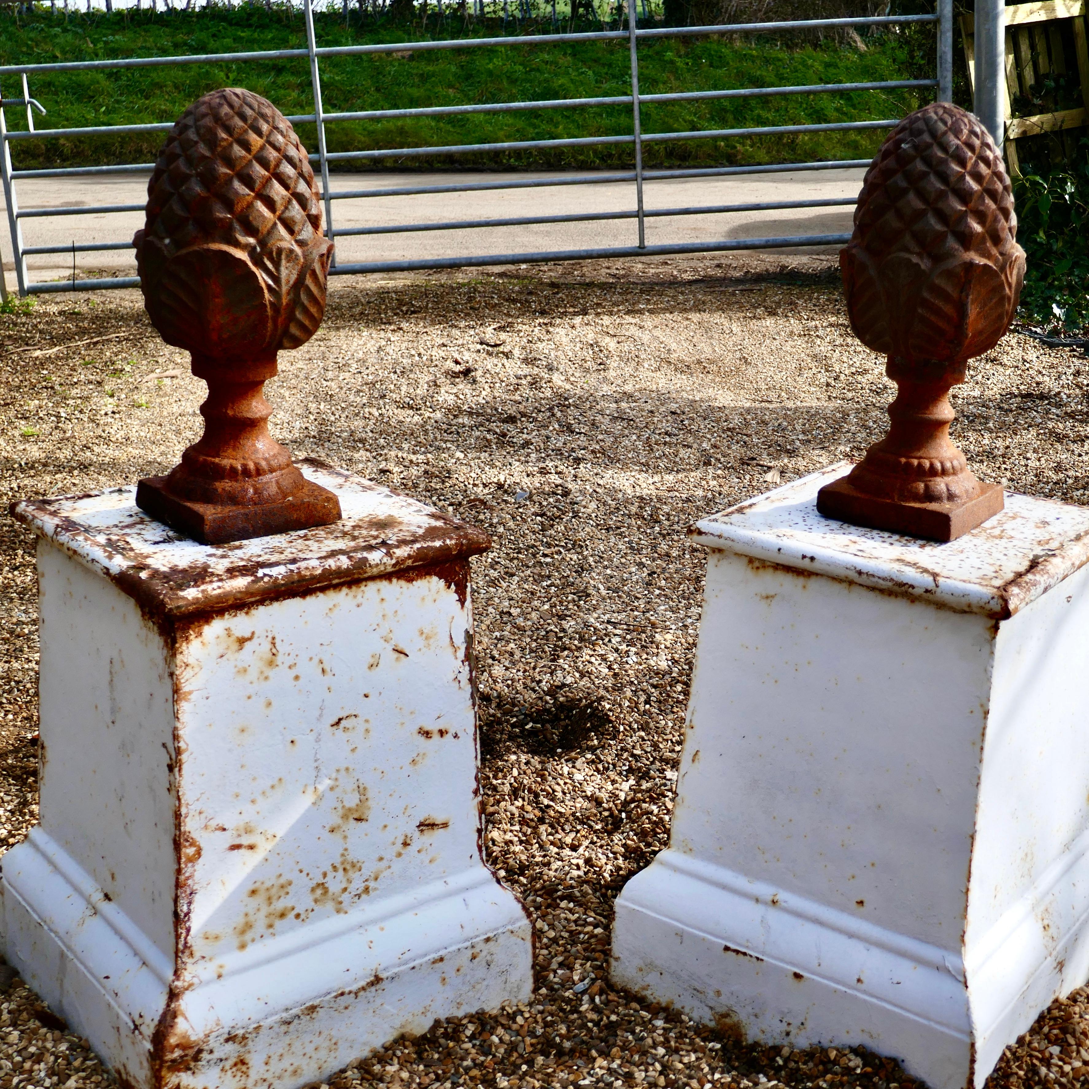 Pair of iron pine cone gate post finials

An elegant pair of traditional weathered iron gate pier finials .
Often called Pineapples, Pine Cones or even Artichokes
This is a superb pair of Gate Post finials in good weathered condition as viewed
