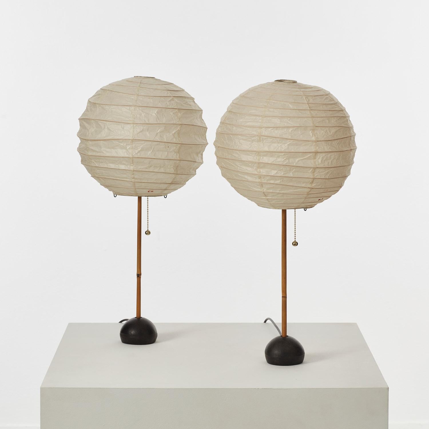 This pair of model BB1-30DD table lamps are a rare variation of Isamu Noguchi’s vast catalogue of Akari lamps. Noguchi (1904–1988) was an artist, sculptor, furniture designer, ceramicist, theatre designer and landscape architect. In 1951, he began