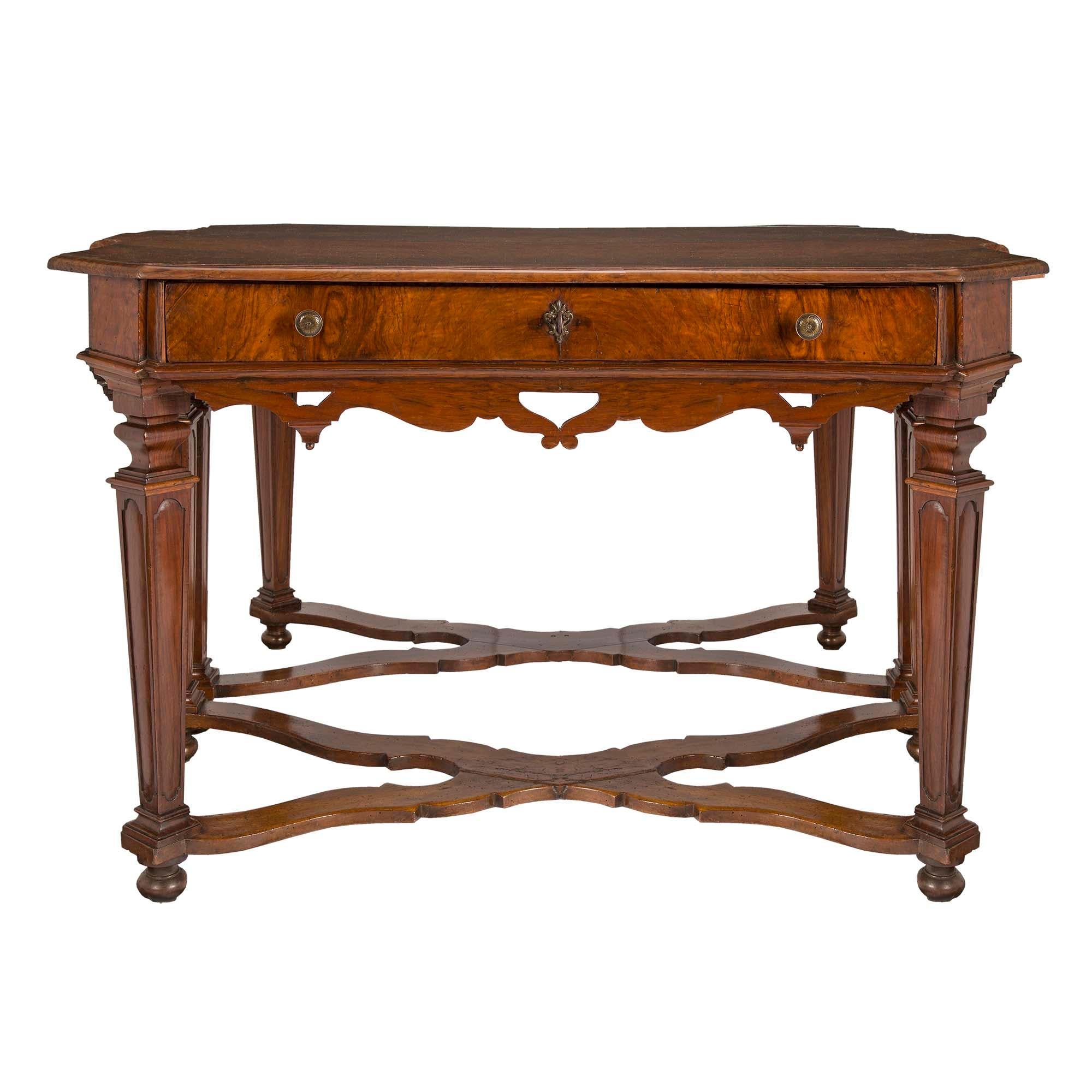 A very handsome and unique Italian 17th century Louis XIV Period walnut consoles/center table from Florence. The consoles may be displayed seperately or when placed back to back may be used as a center table. Each console is raised on topie feet
