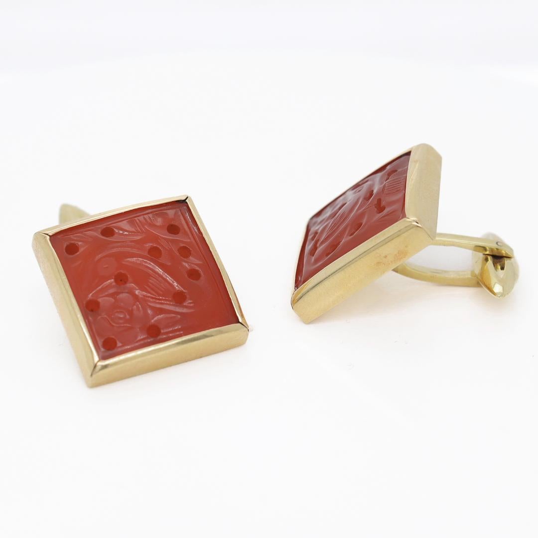 A fine pair of vintage cufflinks.

In 18k yellow gold.

With bezel-set carved carnelian cabochons, hinged posts, and toggle backs

Marked 750 for 18k gold and the Italian maker's mark 715AL.

Simply a wonderful pair of cufflinks for the sharp