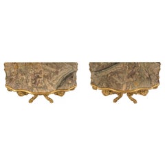 Pair of Italian 18th Century Baroque Giltwood and Marble Four Legged Consoles