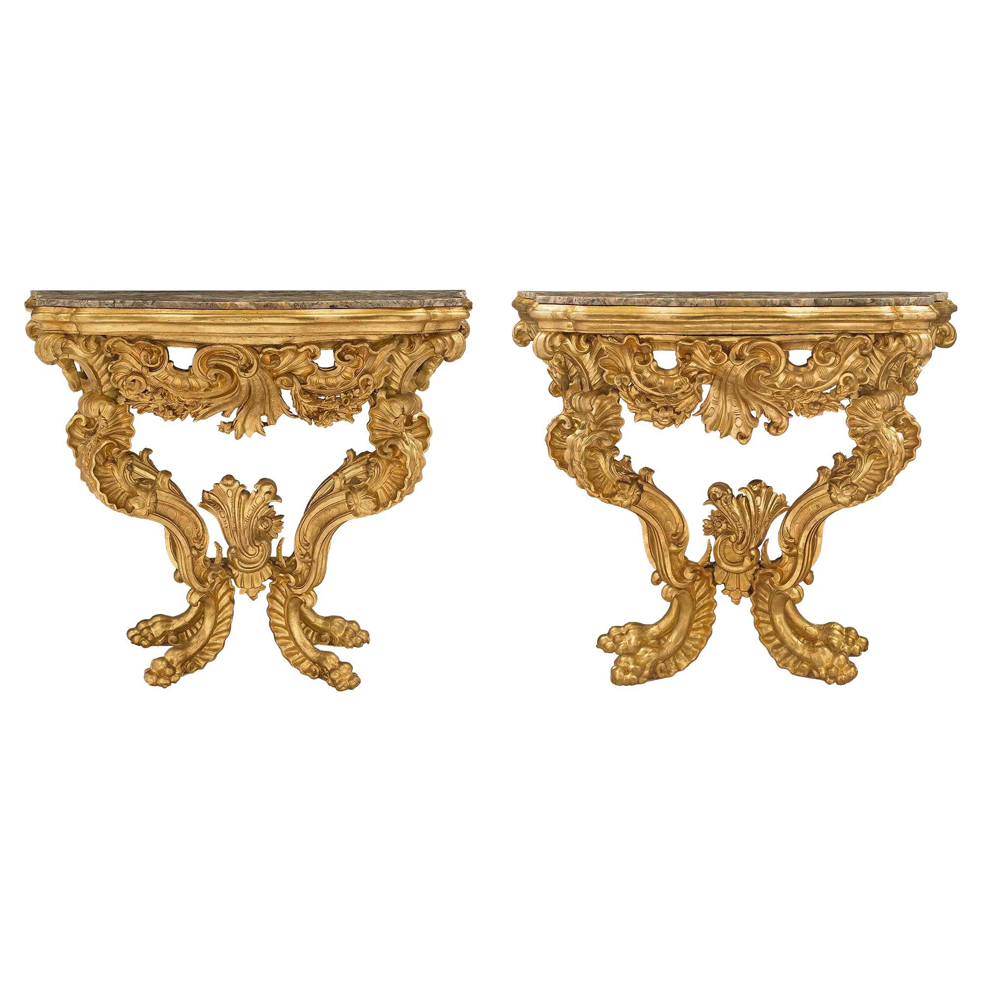 Pair of Italian 18th Century Baroque Giltwood and Marble Four Legged Consoles