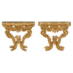 Pair of Italian 18th Century Baroque Giltwood and Marble Four Legged Consoles