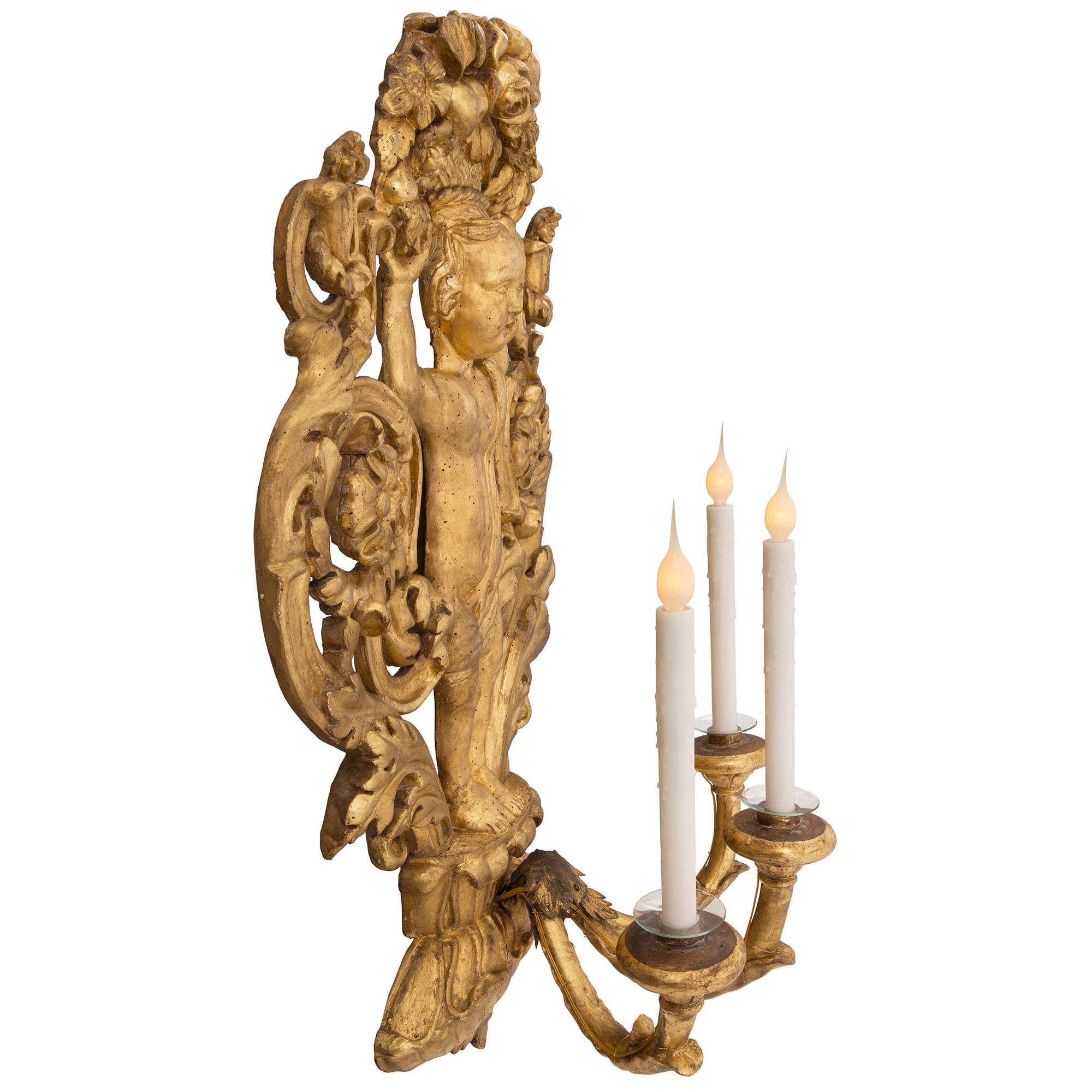 Pair of Italian 18th Century Baroque Period Giltwood Three-Arm Sconces In Good Condition For Sale In West Palm Beach, FL