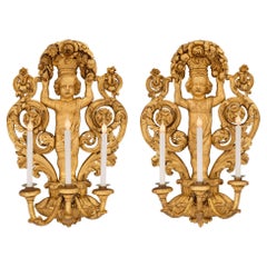 Antique Pair of Italian 18th Century Baroque Period Giltwood Three-Arm Sconces