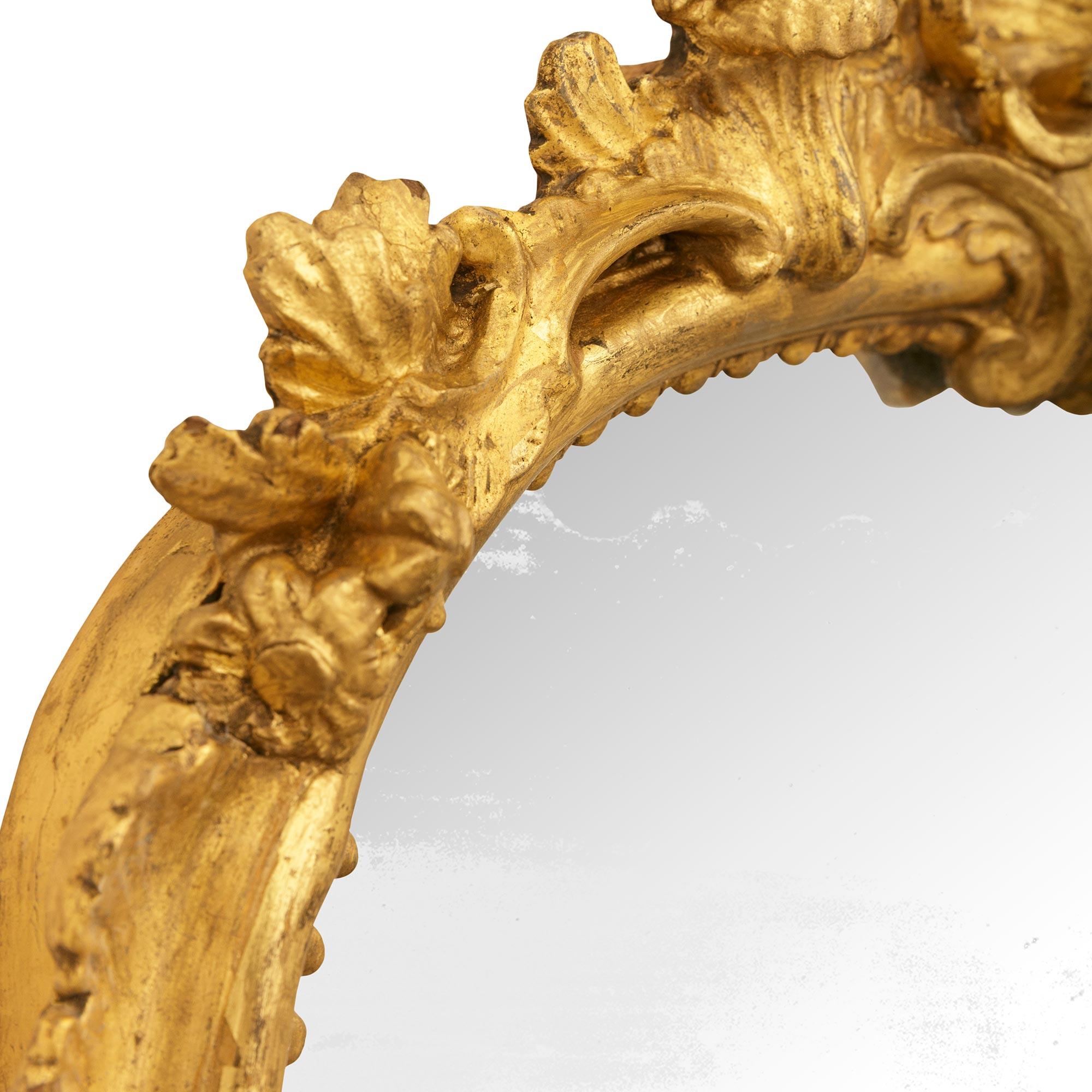 18th Century and Earlier pair of Italian 18th century Giltwood and patinated Bronze mirrored sconces For Sale