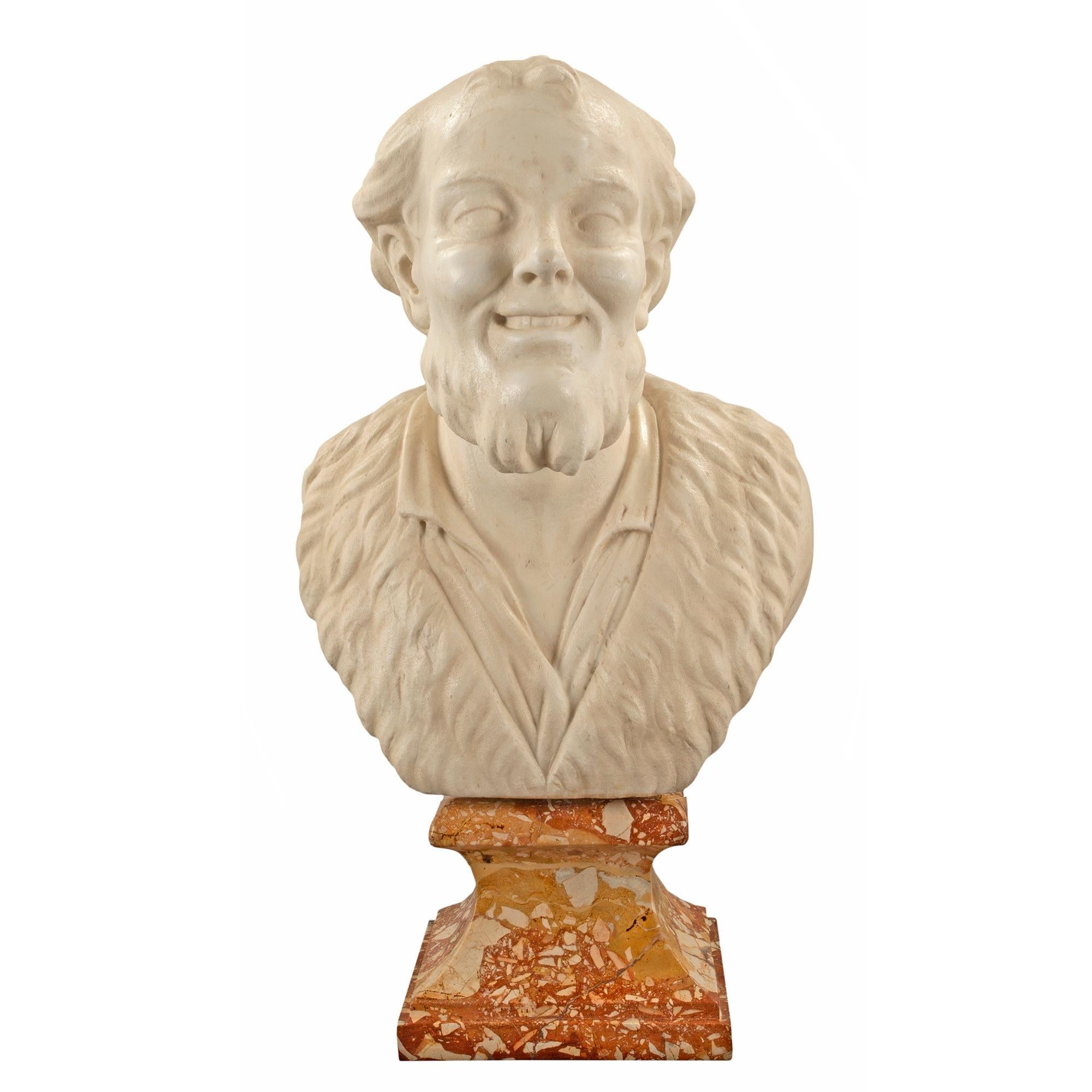 A handsome pair of Italian 18th century marble busts of Democritus and Heraclitus. The busts are in white Carrara marble and raised by rectangular mottled tapered Breccia Gialla marble socles. Each Philosopher is wearing formal attire with wonderful