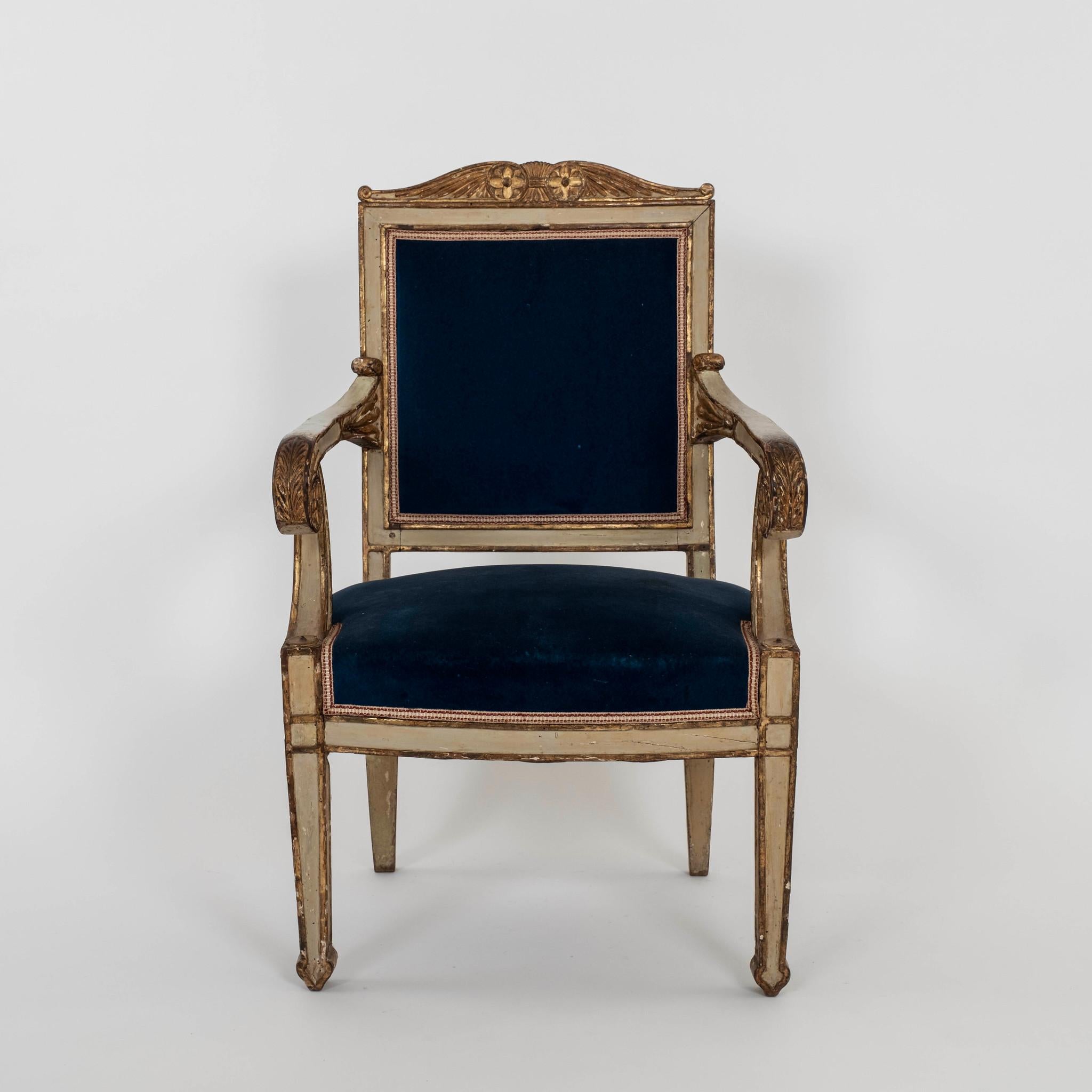 Pair of 18th century hand carved painted and parcel gilt Neoclassical armchairs in royal blue velvet. These chairs are also available C.O.M.