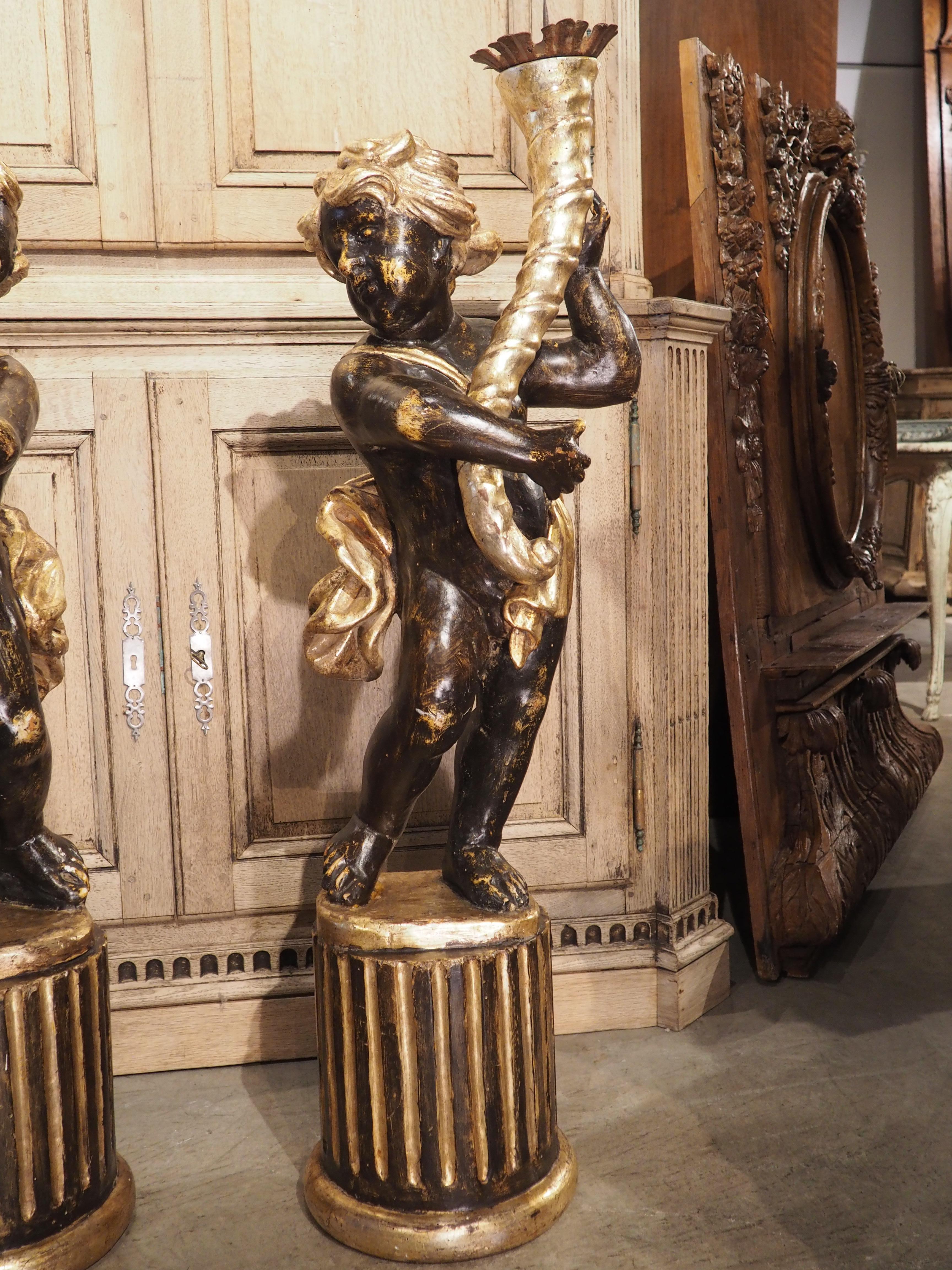 Hand-Carved Pair of Italian 18th Century Painted and Gilt Putti with Cornucopia Torcheres For Sale
