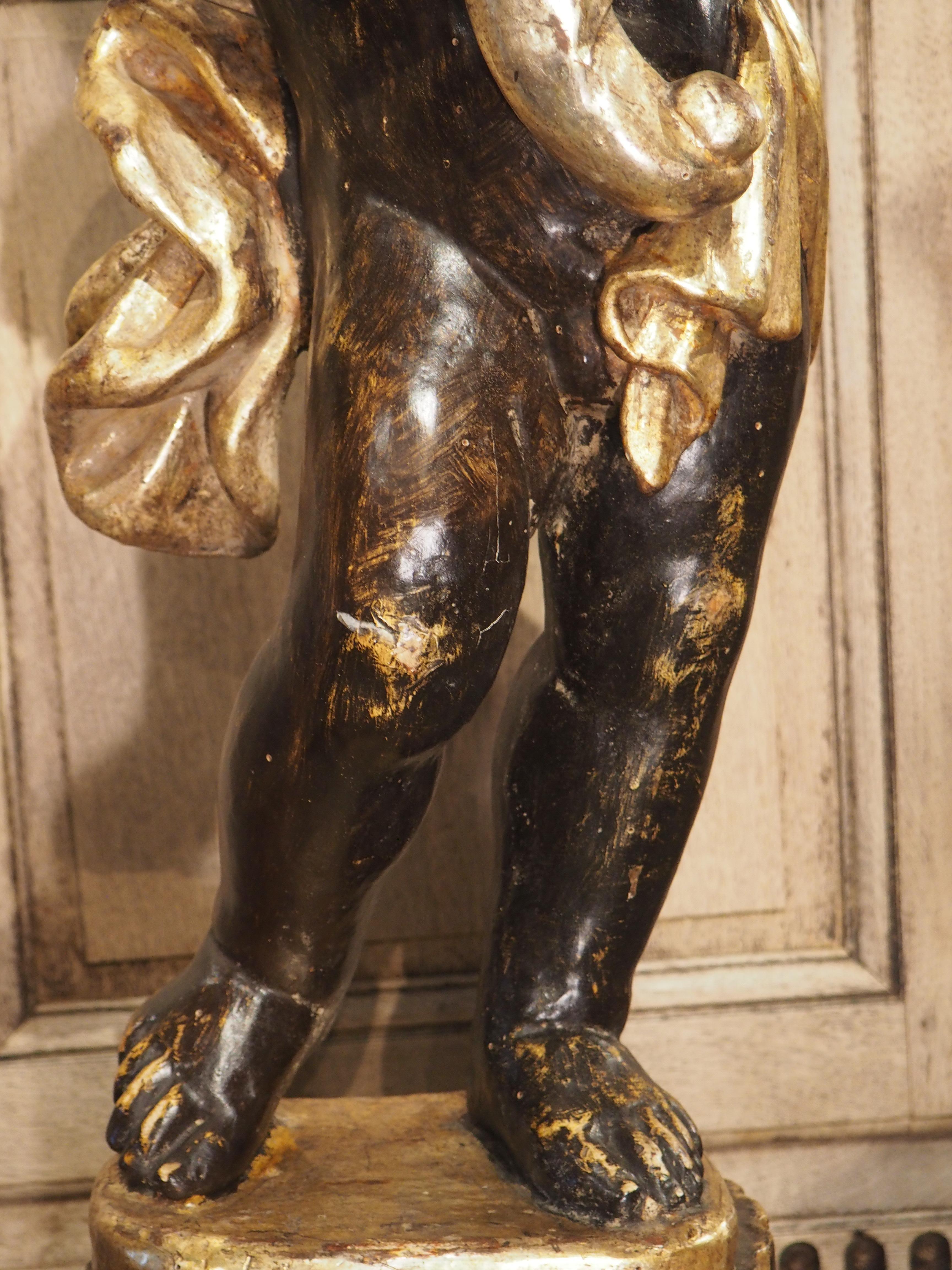 Iron Pair of Italian 18th Century Painted and Gilt Putti with Cornucopia Torcheres For Sale
