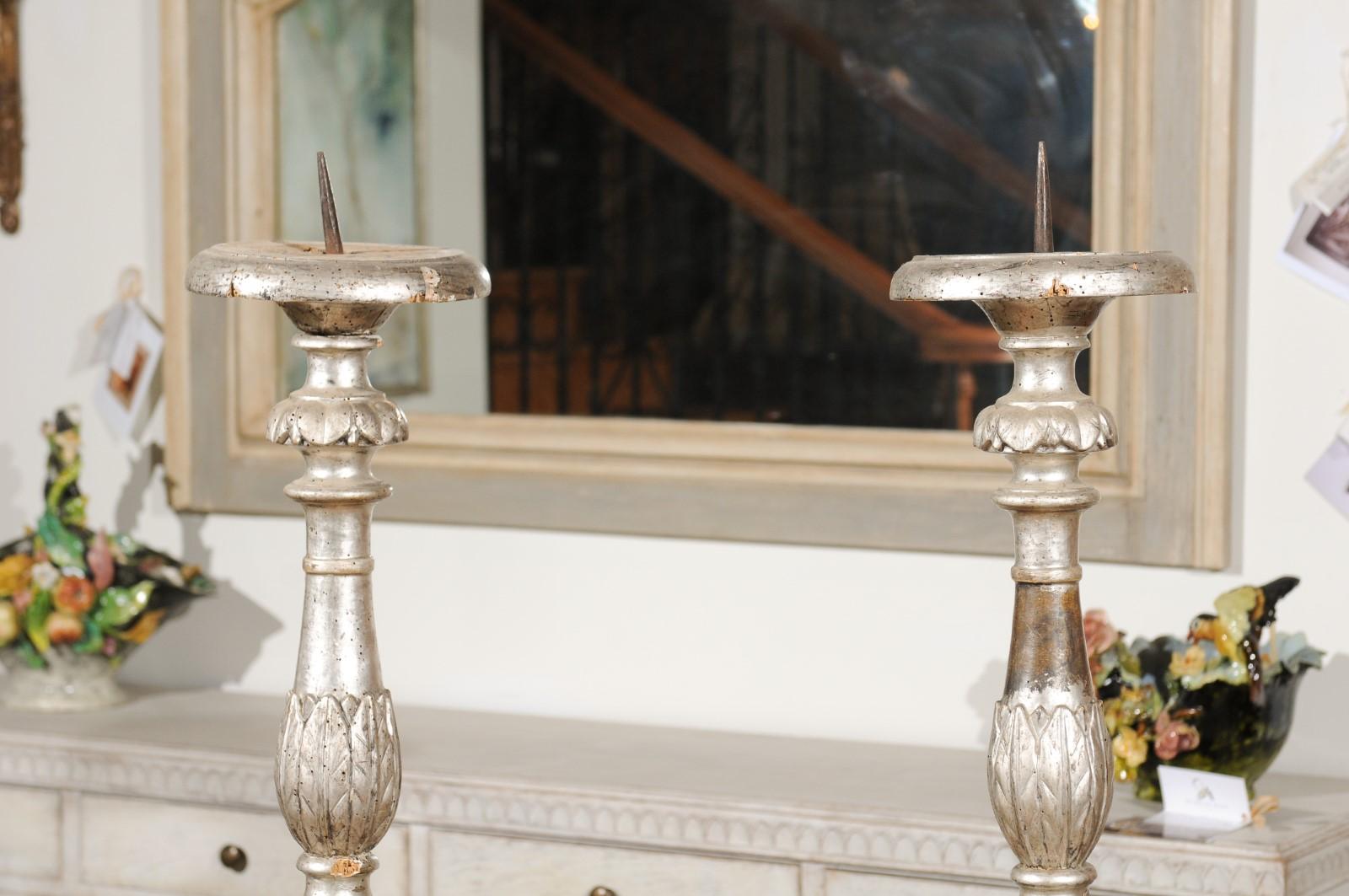 Carved Pair of Italian 18th Century Silver Candlesticks with Gilt Star and Waterleaves For Sale