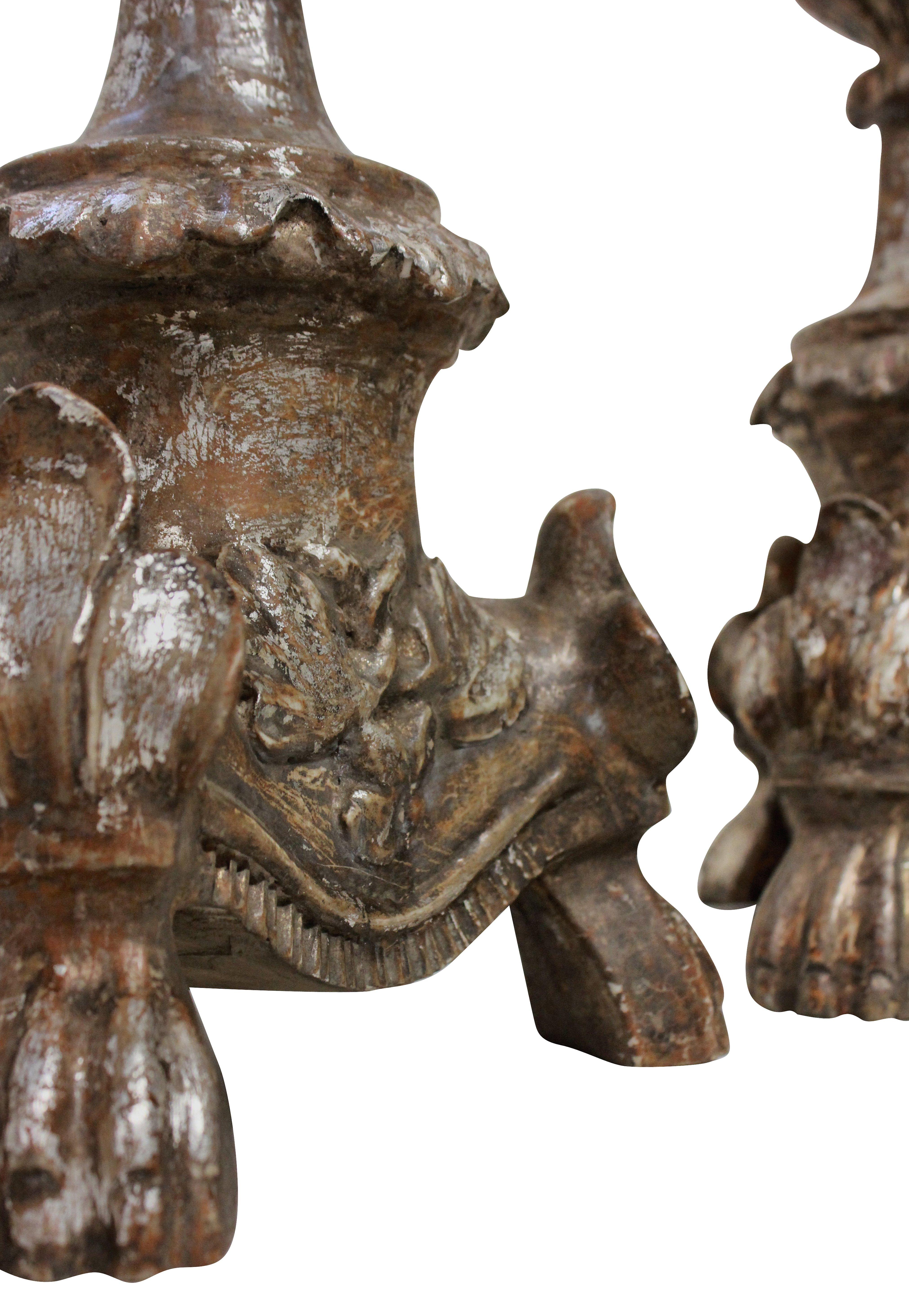 A pair of Italian 18th century, carved and silver leaf candlesticks as lamps.
 