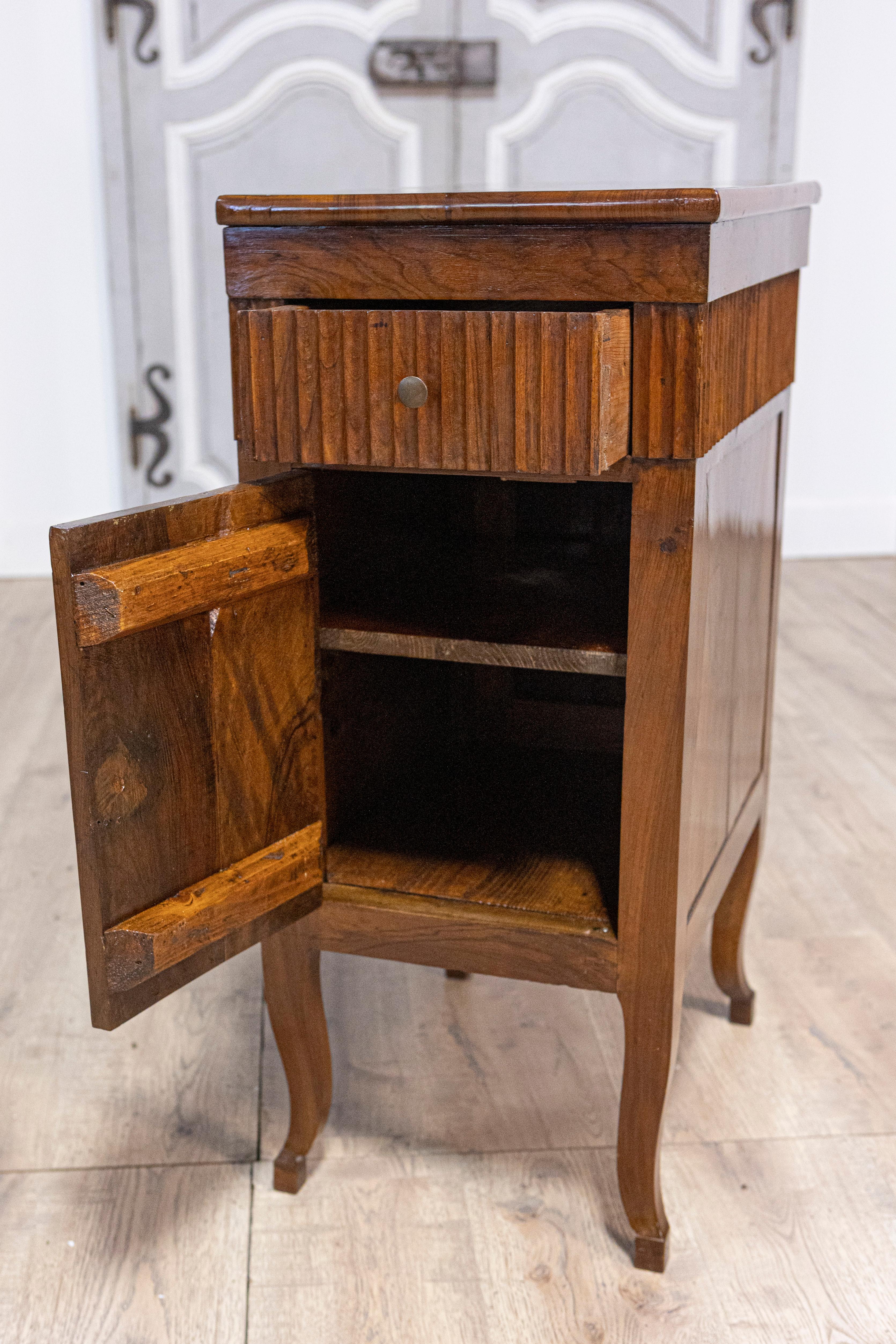 18th Century and Earlier Pair of Italian 18th Century Walnut Bedside Chests with Carved Fluted Drawers For Sale