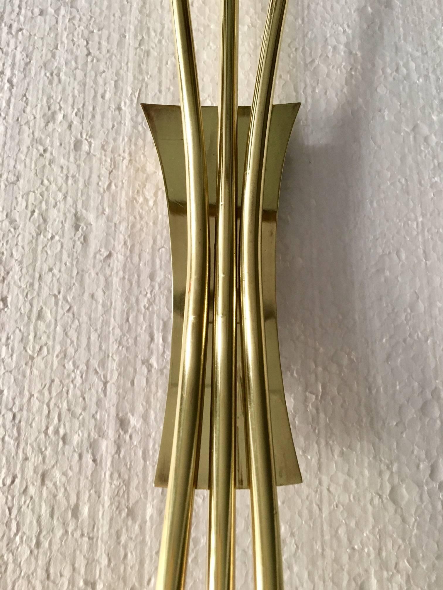 Pair midcentury Italian sconces in brass, Oscar Torlasco style, each sconces has three single candelabra, these have been rewired.
