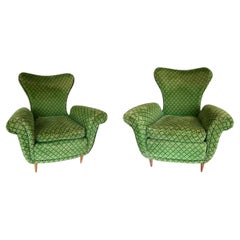 Pair of Italian 1950s armchairs in green velvet